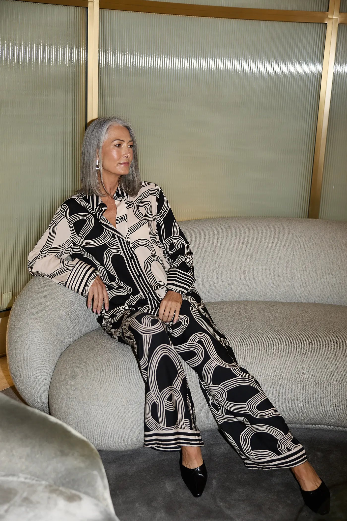 Model wearing ink lines print wide-leg pants and matching shirt set, styled for a modern and sophisticated look in Australian women’s fashion.