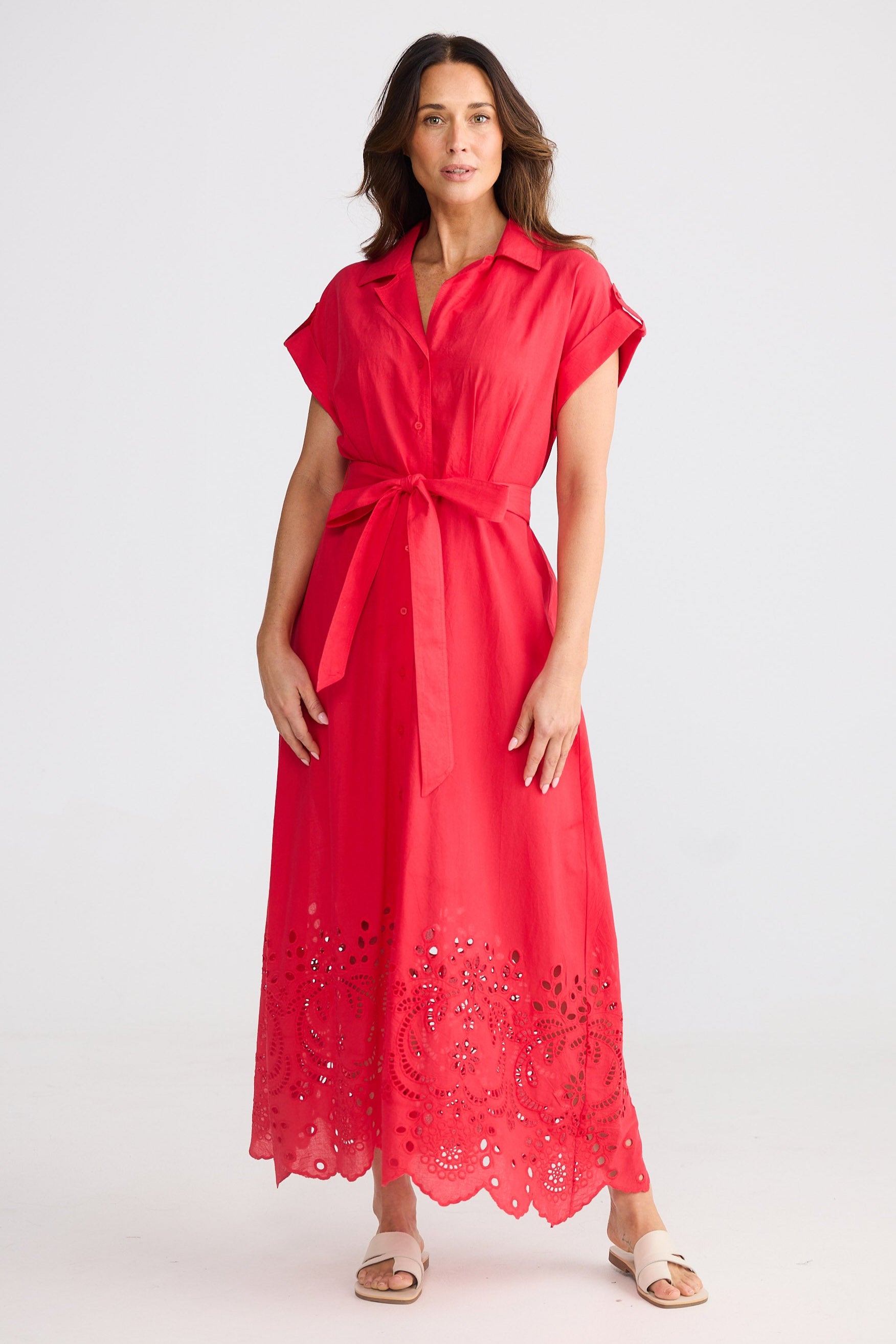 Woman wearing a red dress with a white background