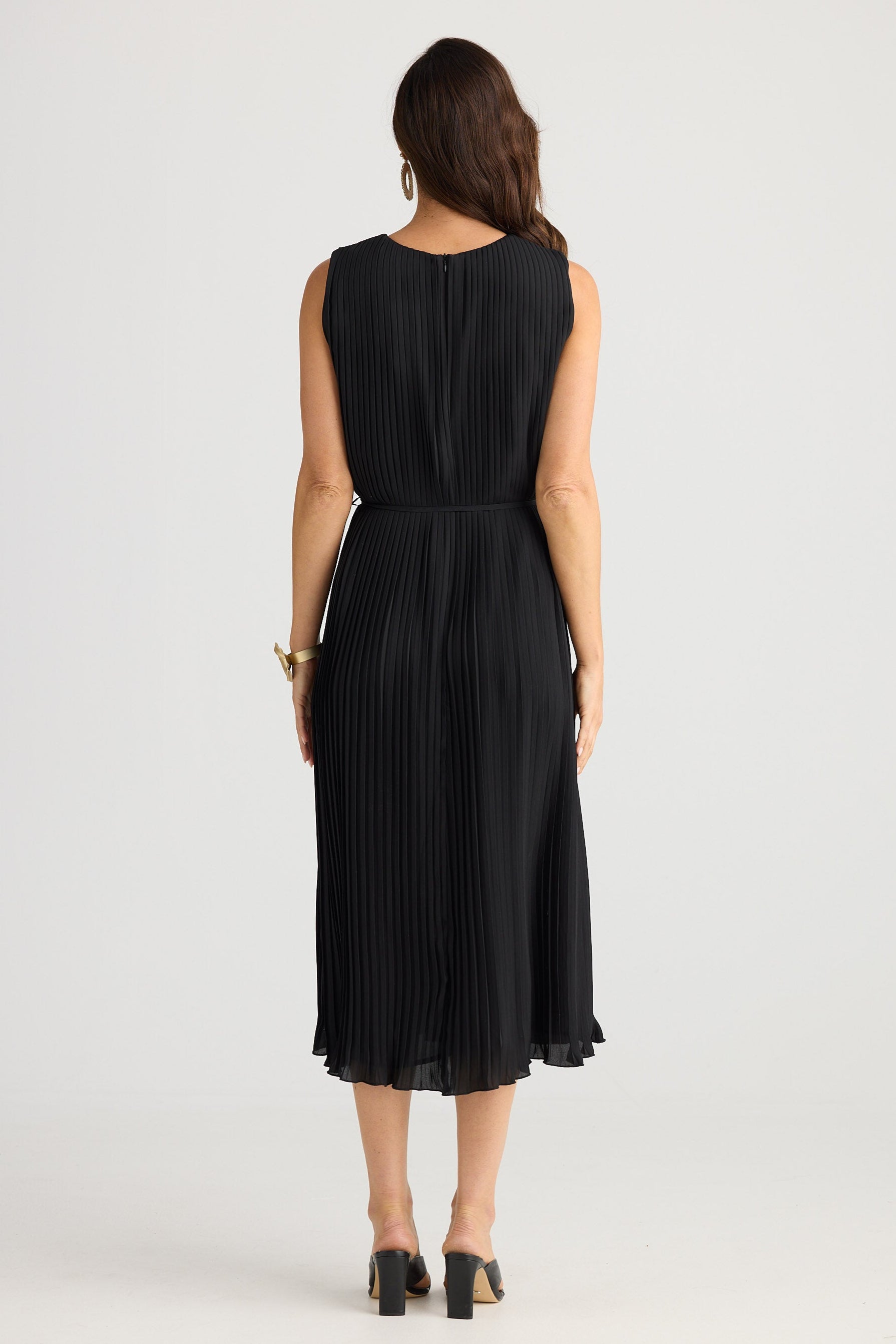 Woman wearing a black dress on a white background