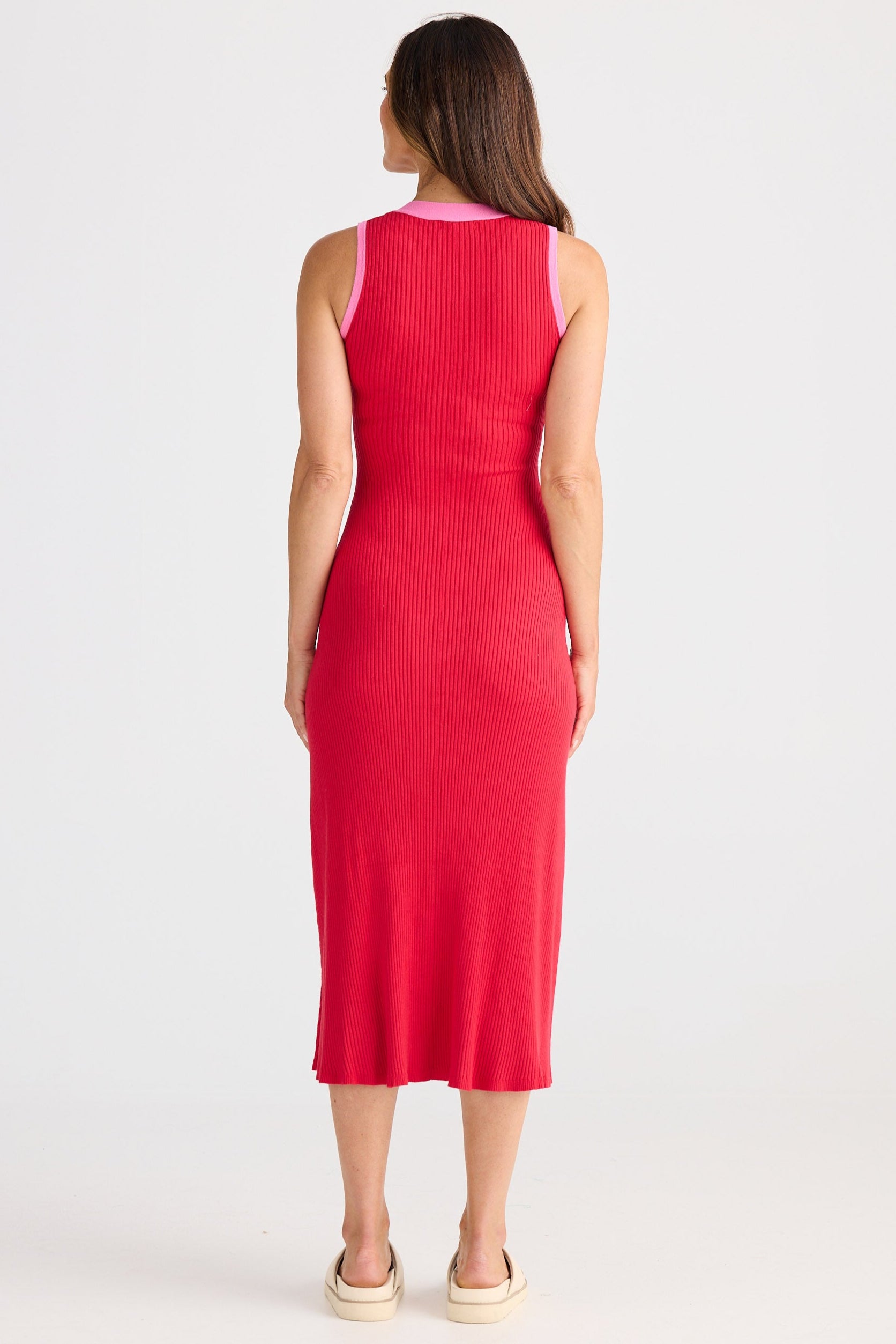 Woman wearing a red dress on a white background