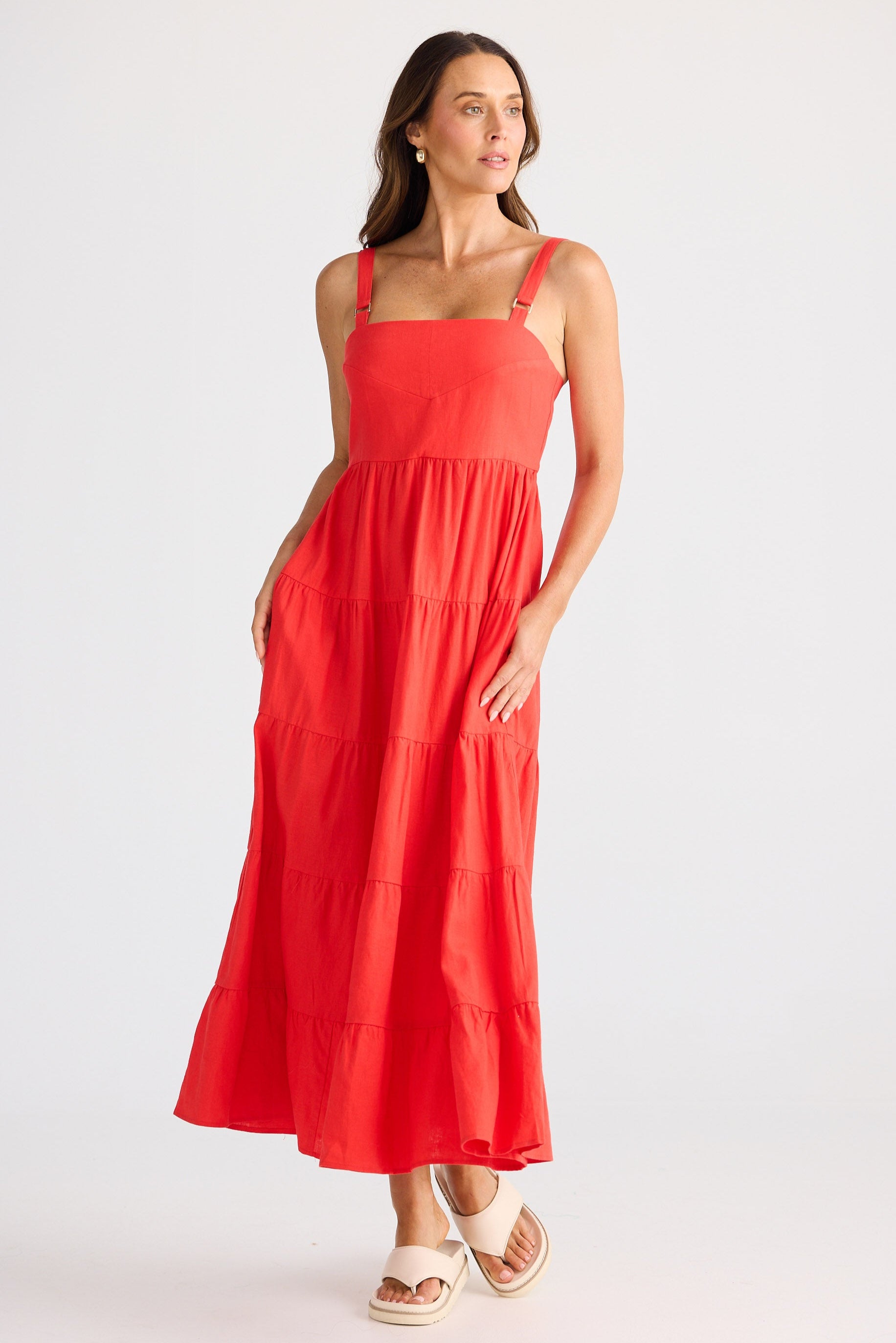 Woman wearing a red dress on a white background