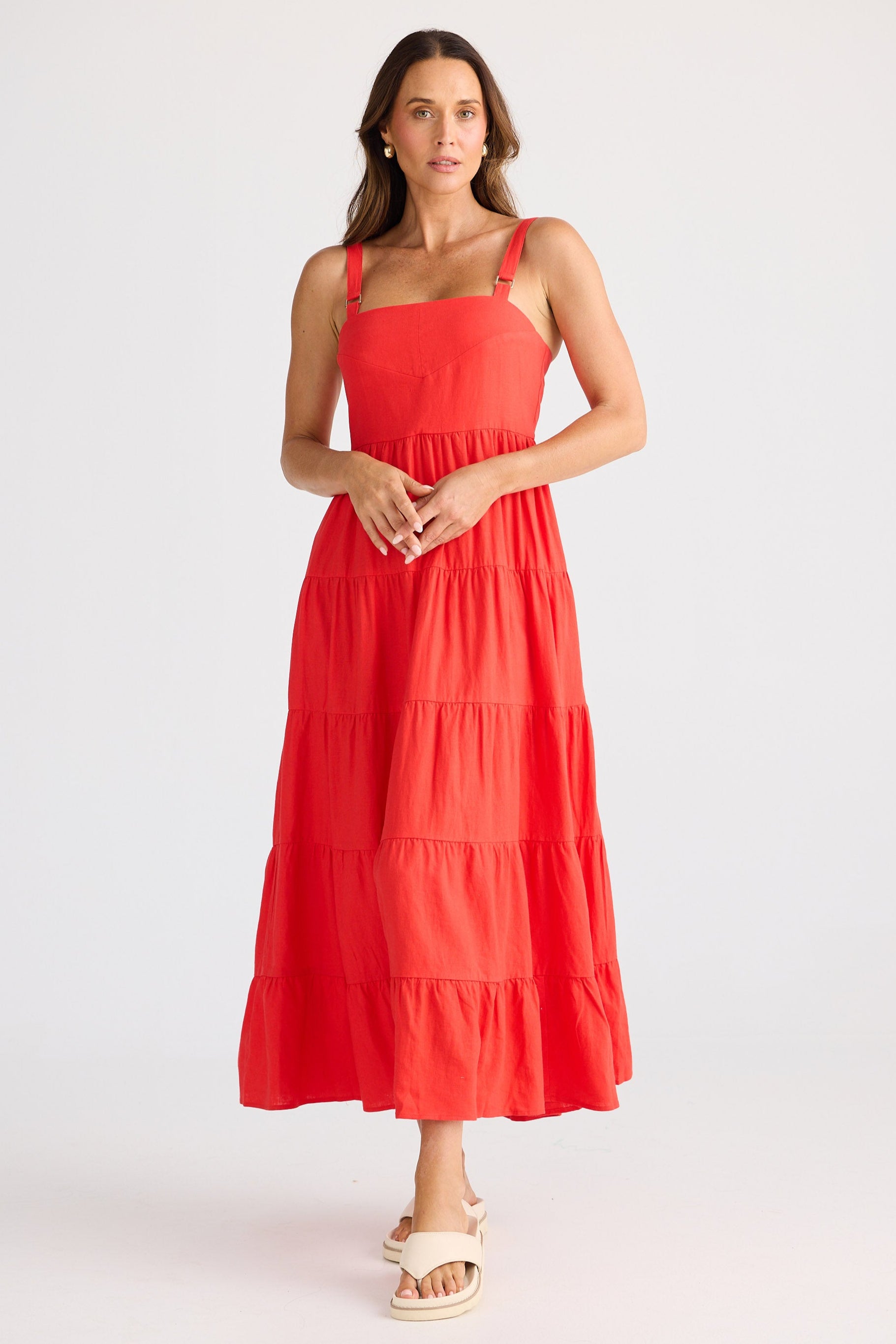Woman wearing a red dress on a white background