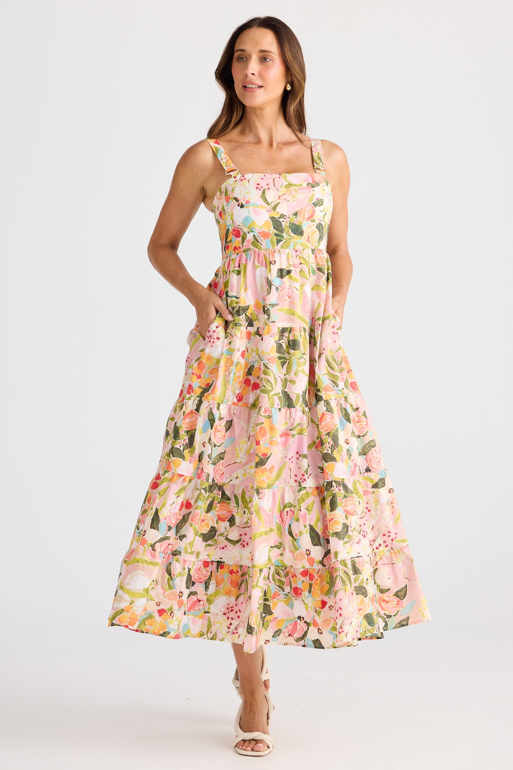 Woman wearing a floral dress on a white background