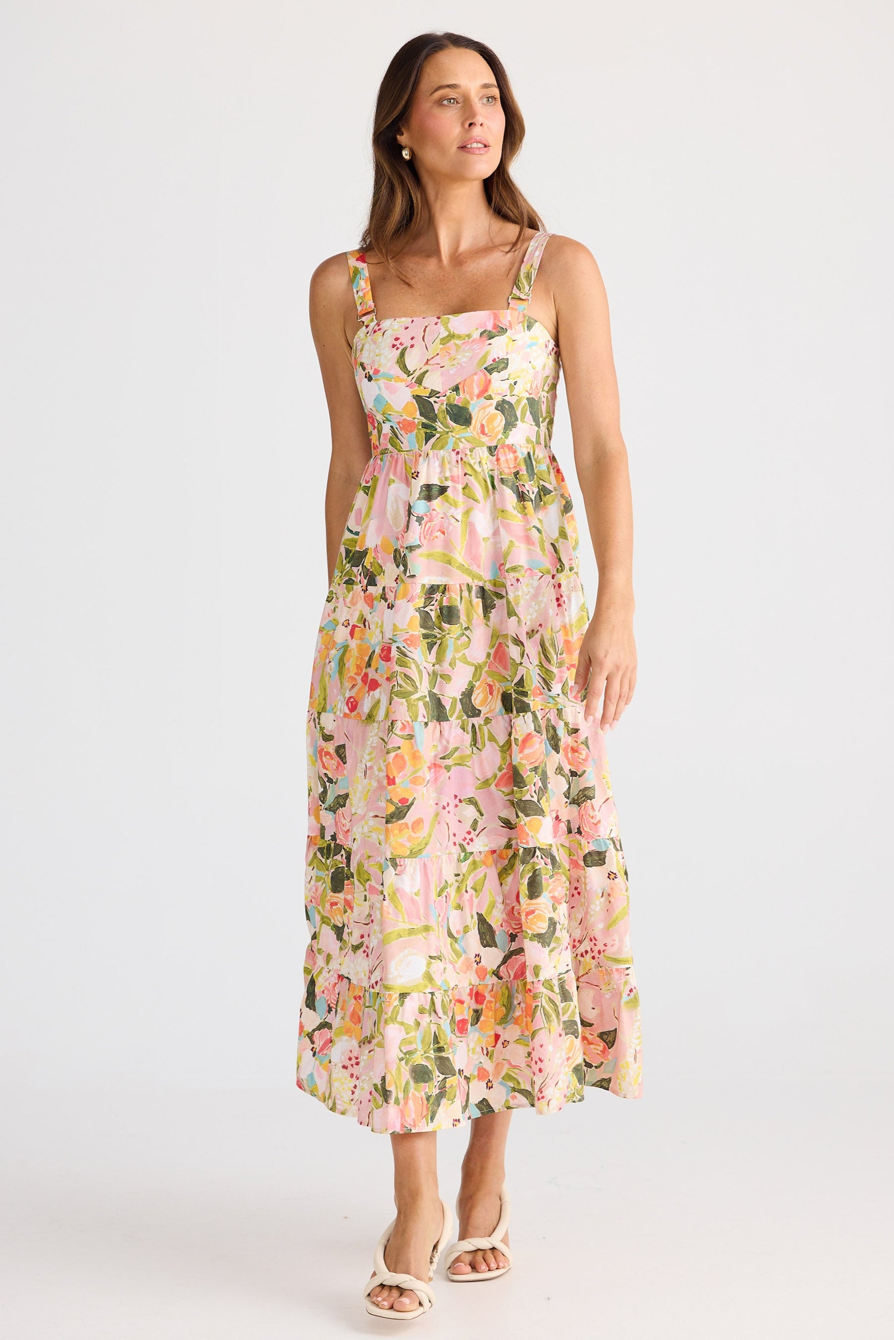 Woman wearing a floral dress on a white background
