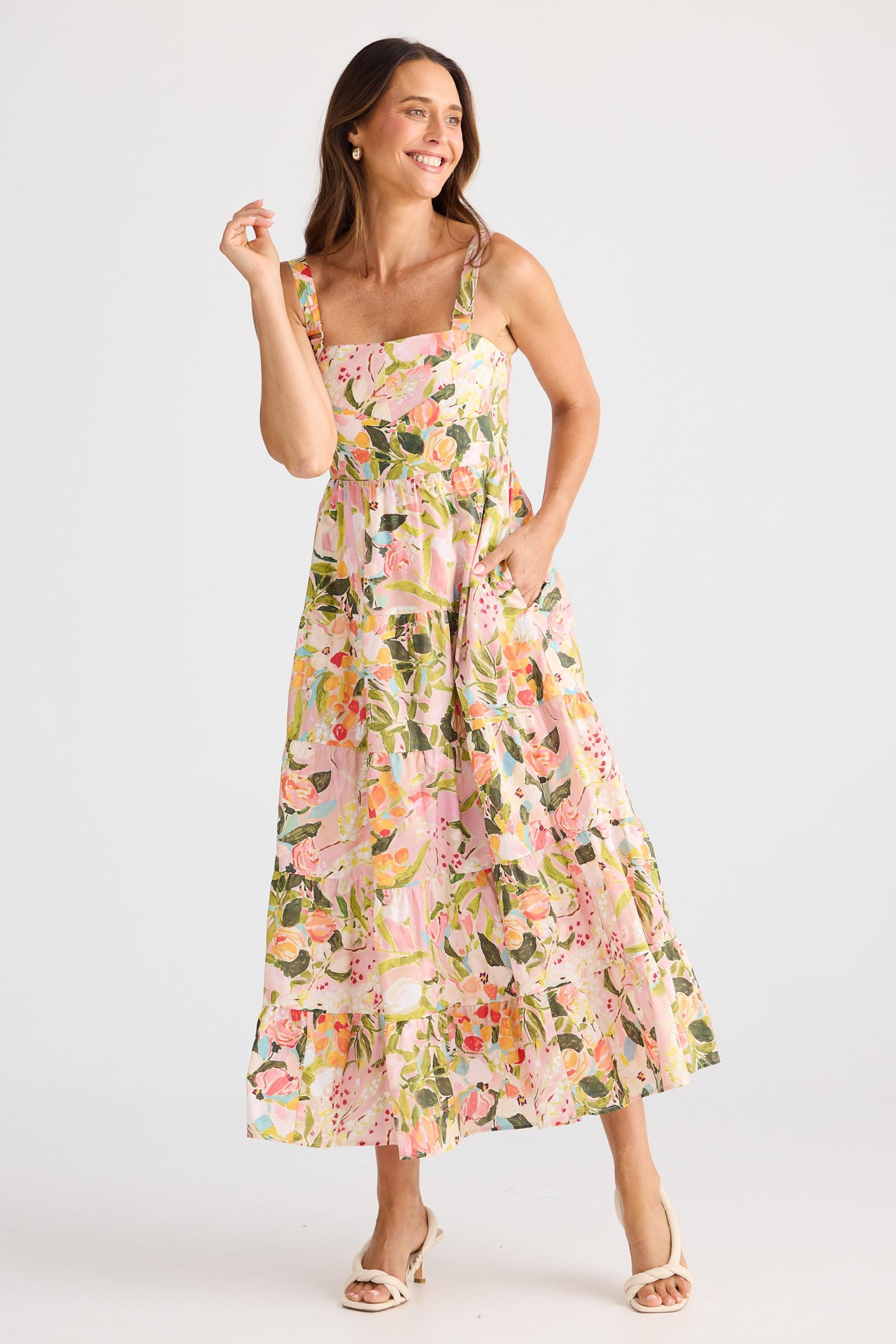 Woman wearing a floral dress on a white background