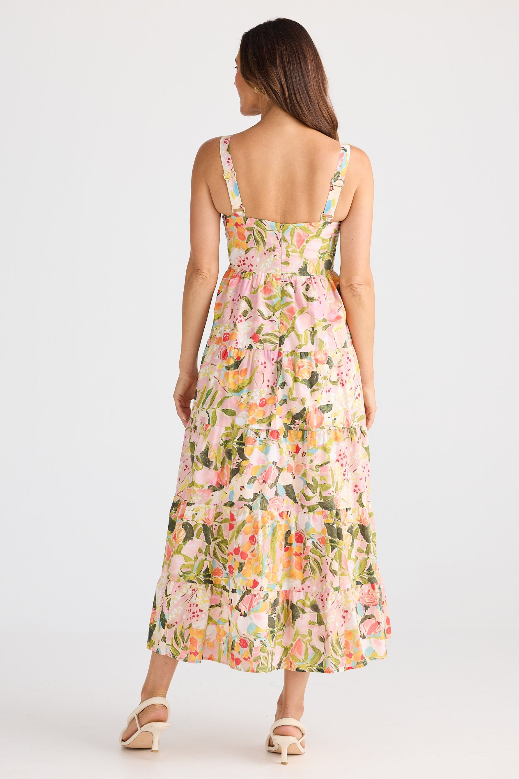 Woman wearing a floral dress on a white background