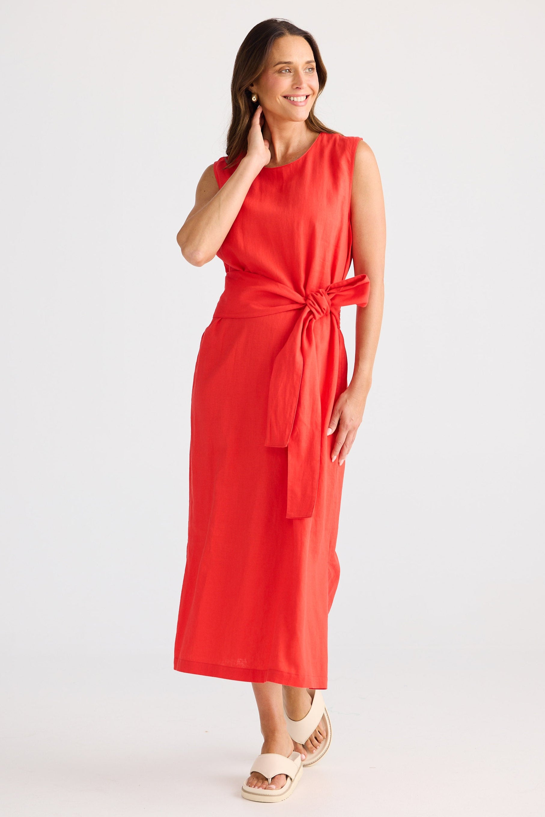 Woman wearing a red dress on a white background
