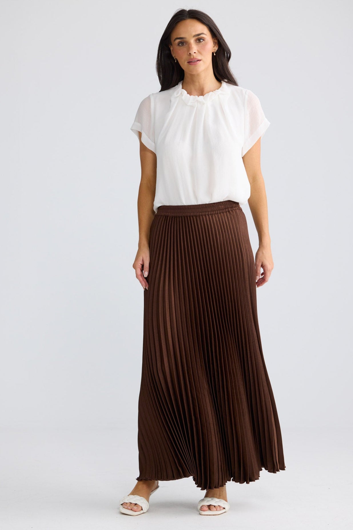 Model wearing Alias Pleated Skirt in Chocolate by Brave + True, view 4.