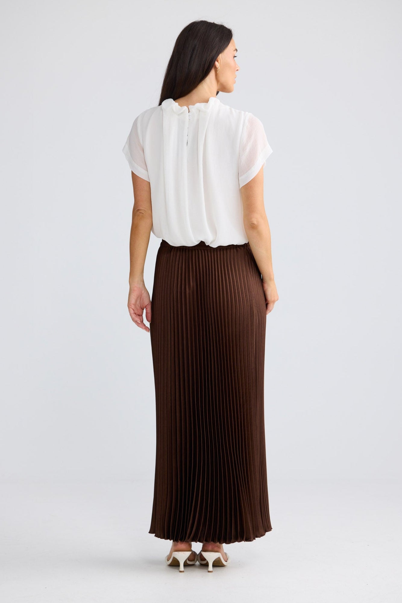 Model wearing Alias Pleated Skirt in Chocolate by Brave + True, view 5.