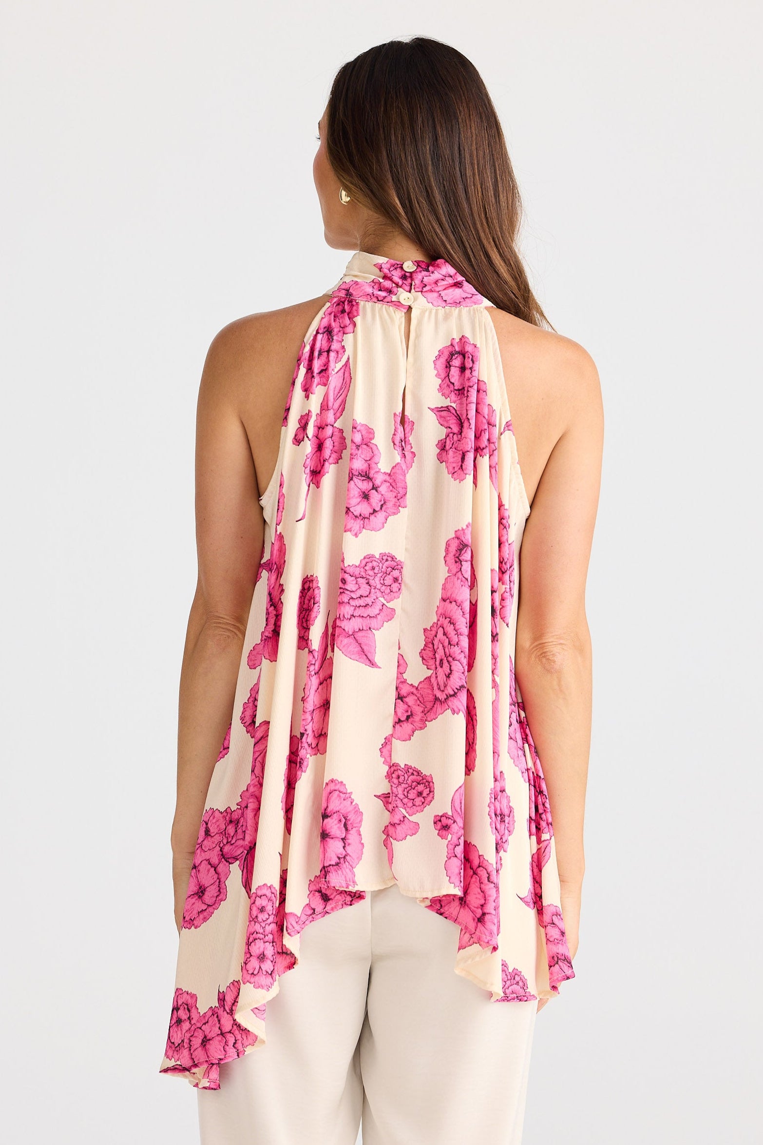 Woman wearing a floral scarf on a white background