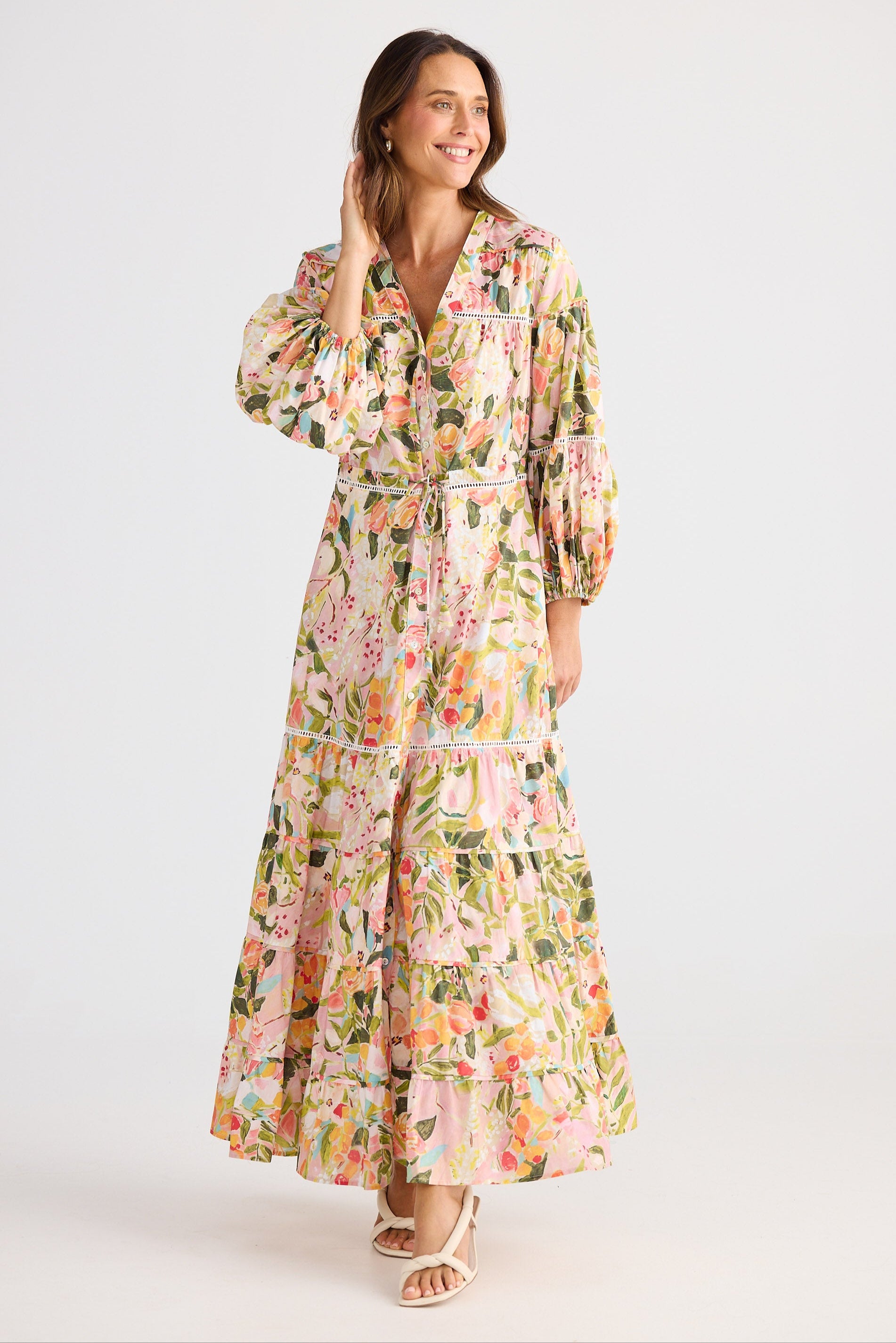 Woman wearing a floral dress on a white background