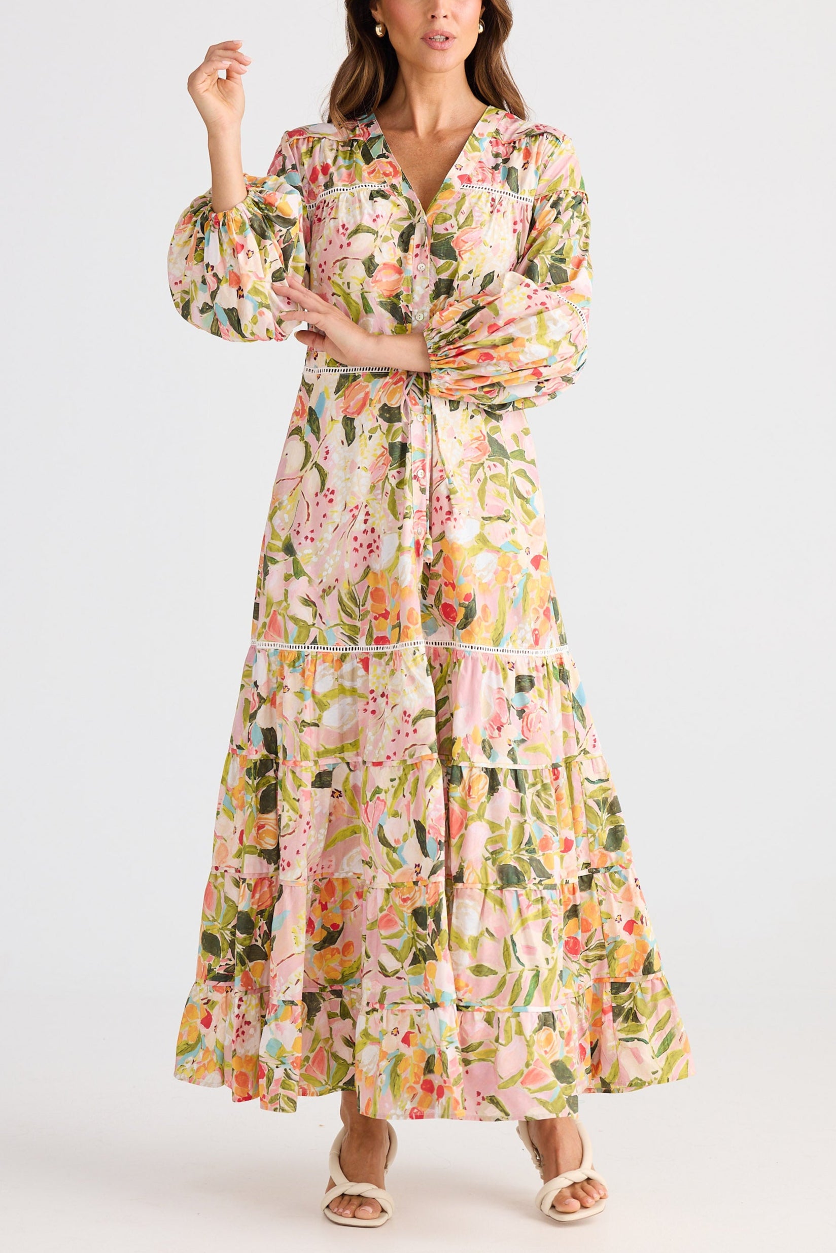 Woman wearing a floral dress on a white background