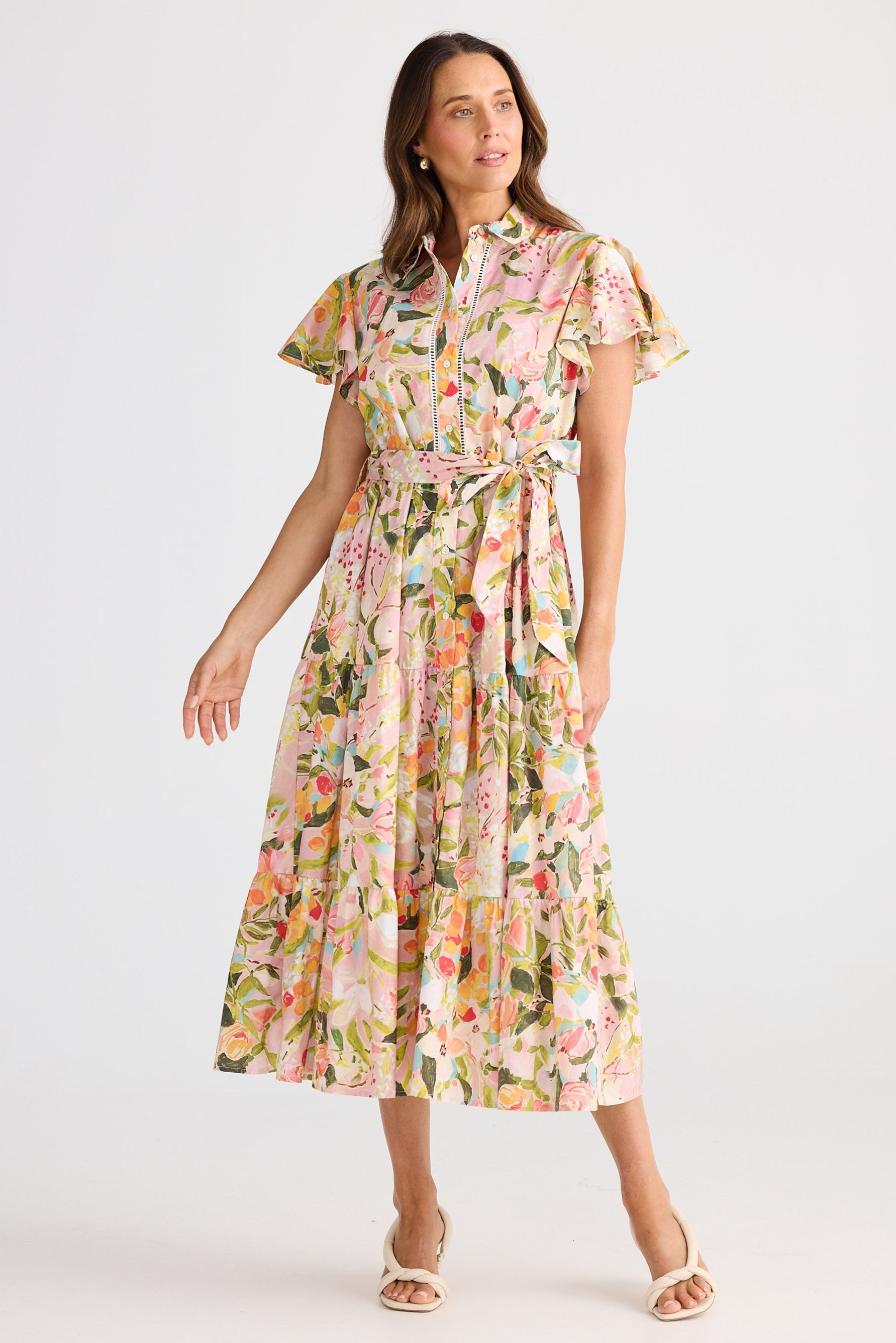 Woman wearing a floral dress on a white background
