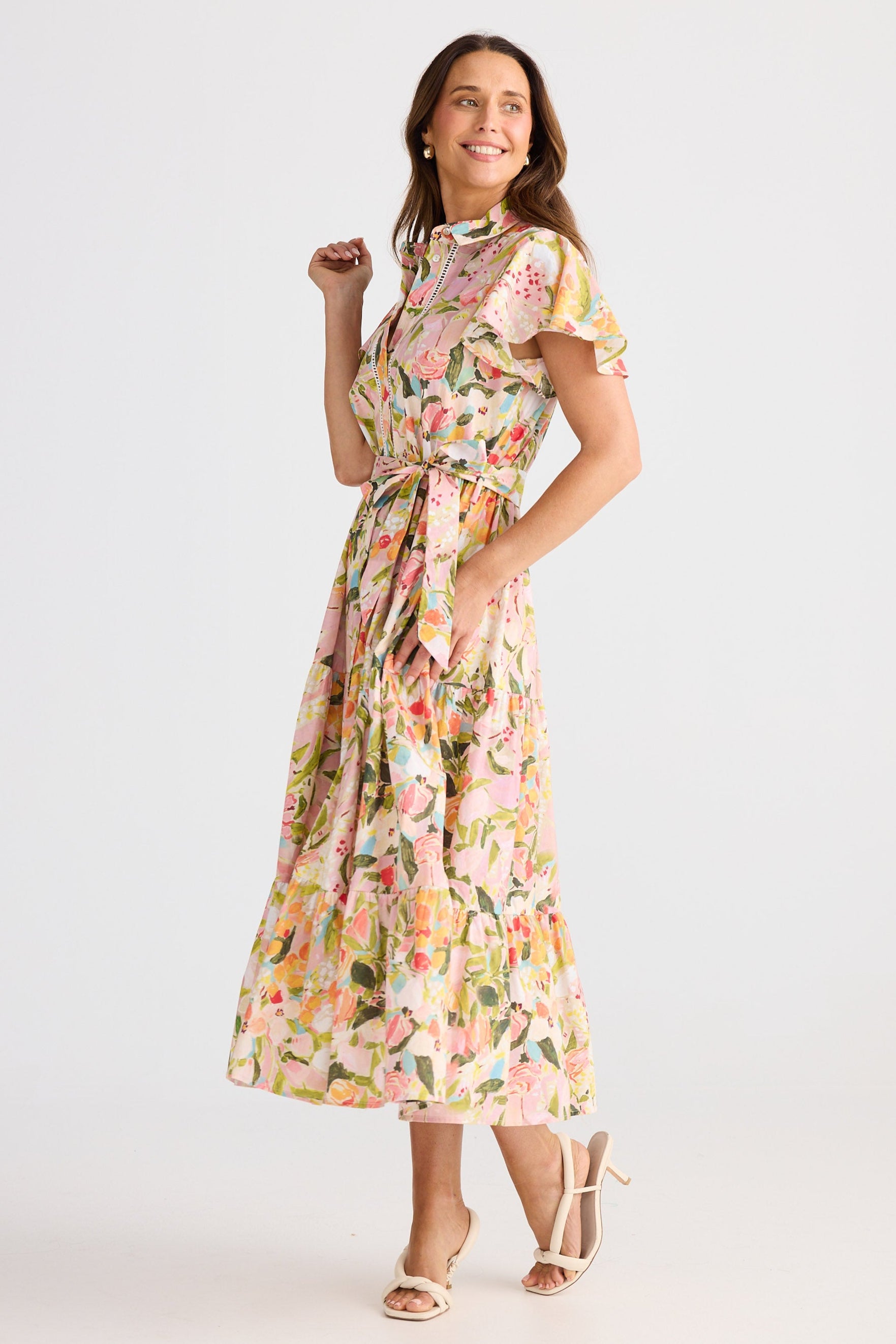 Woman wearing a floral dress on a white background