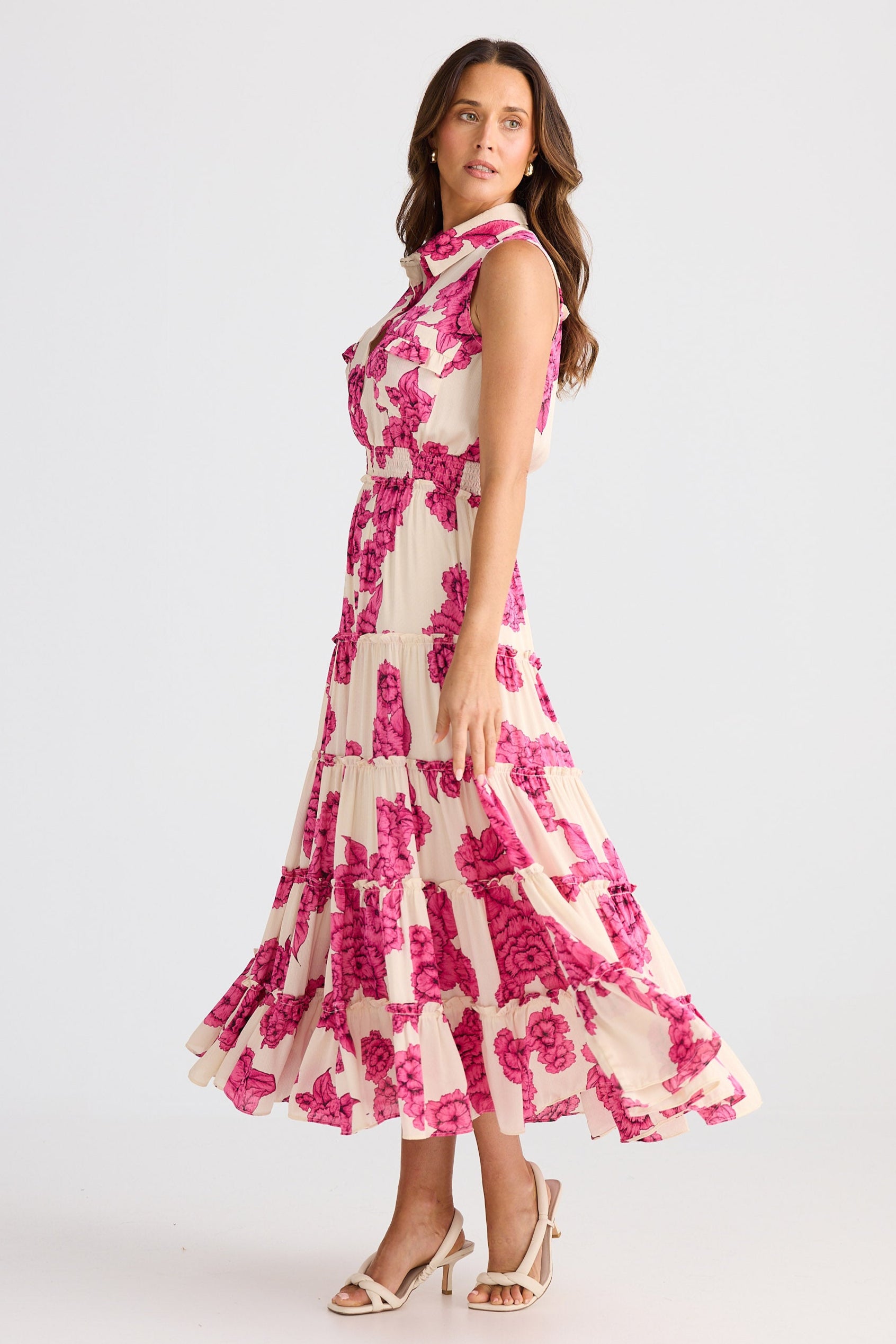 Woman wearing a floral dress on a white background