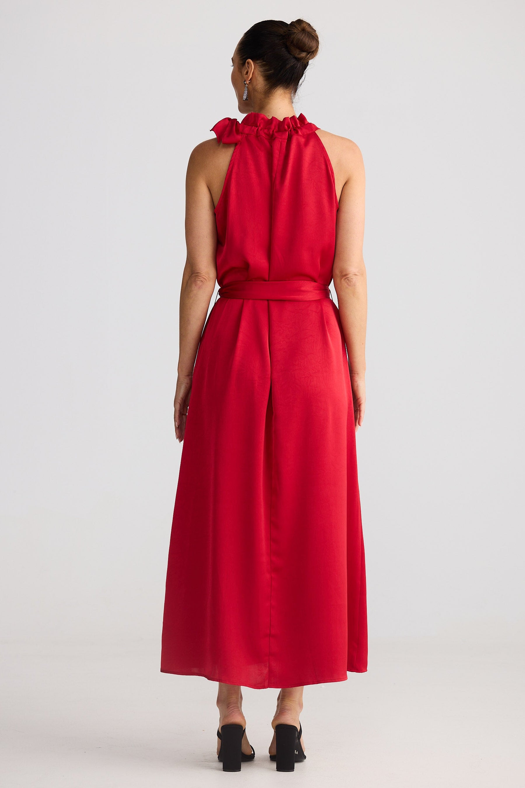 Woman wearing a red dress with a white background