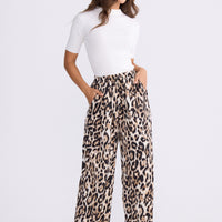 Model wearing Glenda Pant multicolour animal-print pants, straight-leg fit, alternate studio view on white background