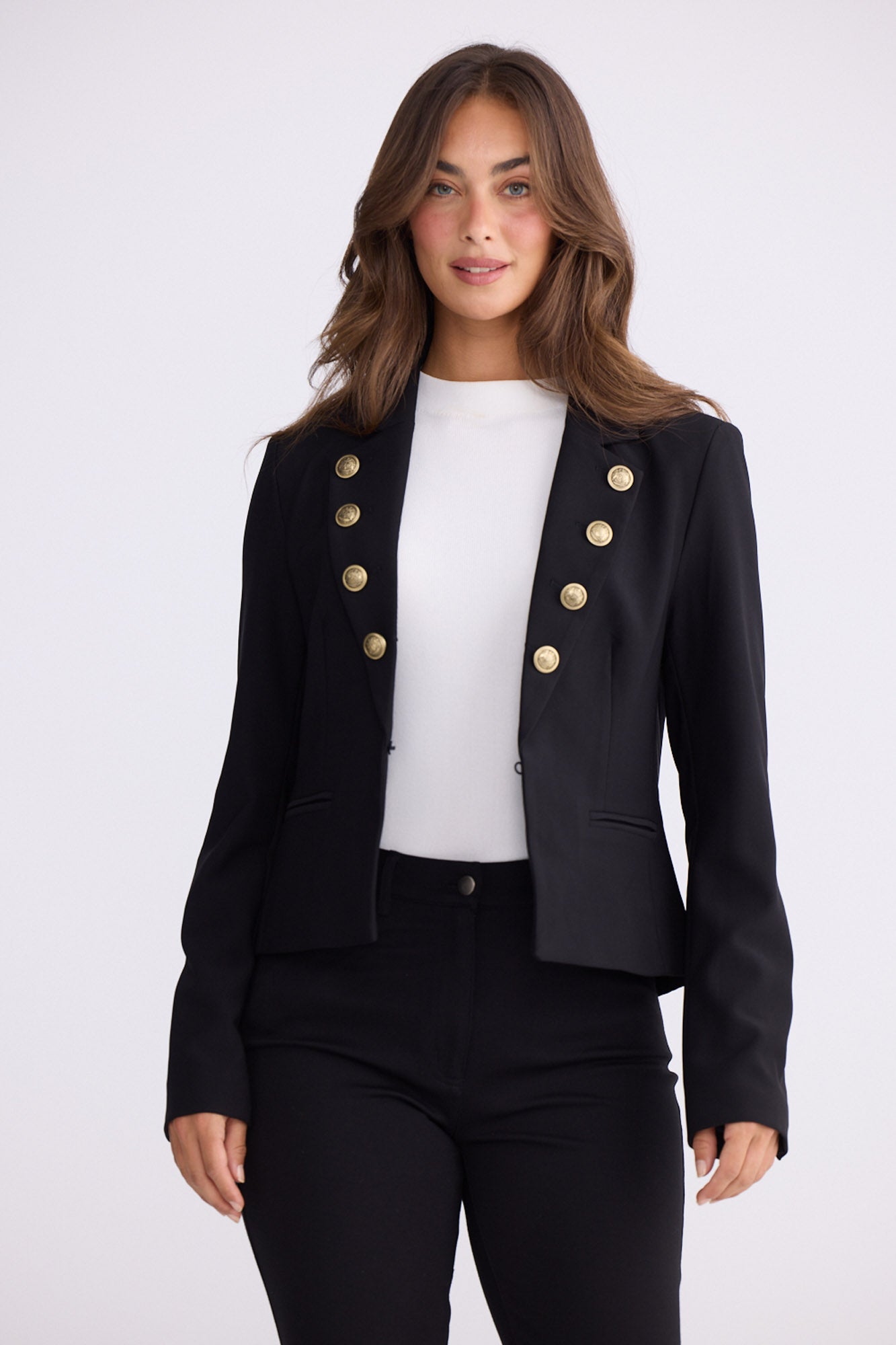 Model wearing St James black blazer with gold buttons and notched lapels, alternate view on white background
