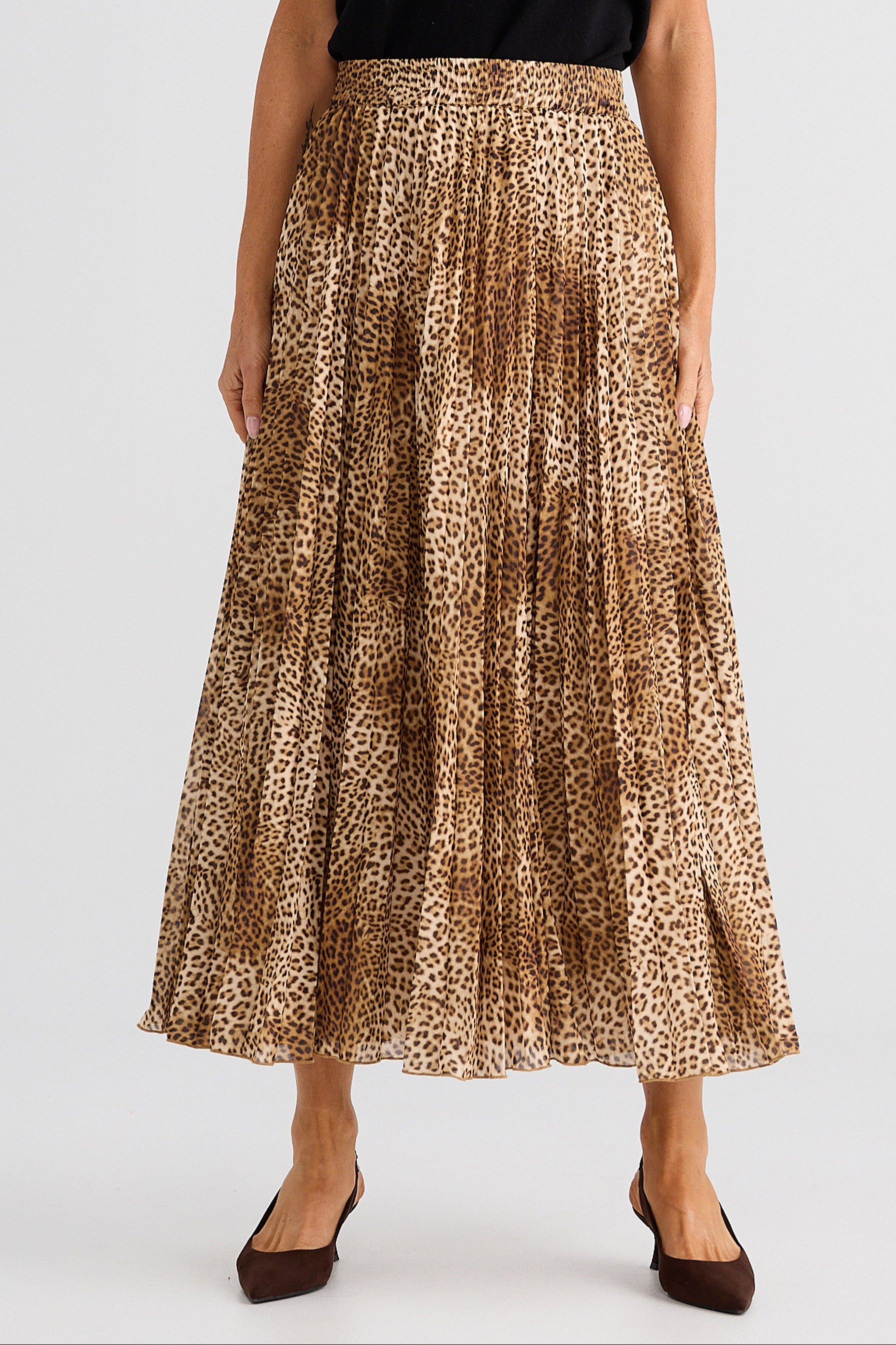 Leopard print skirt worn by a person on a white background