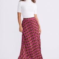Model wearing Alias Pleated Skirt multicolour geometric-print skirt, alternate studio view on white background