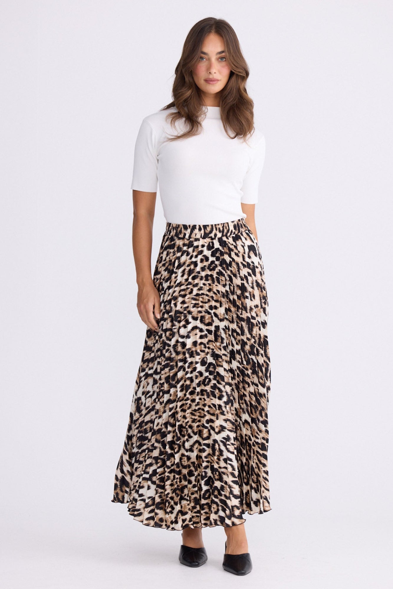 Model wearing Alias Pleated Skirt multicolour animal-print skirt, alternate studio view on white background