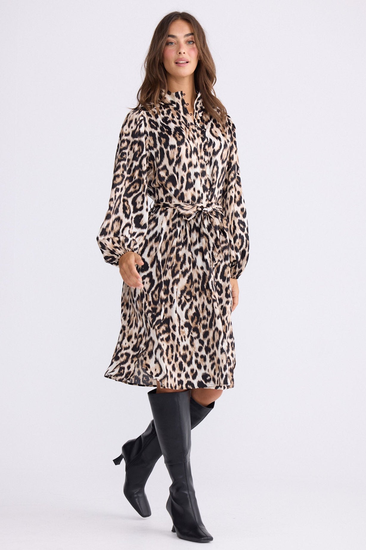 Model wearing Penny Dress in savannah print with high neck and balloon sleeves, front view on white background