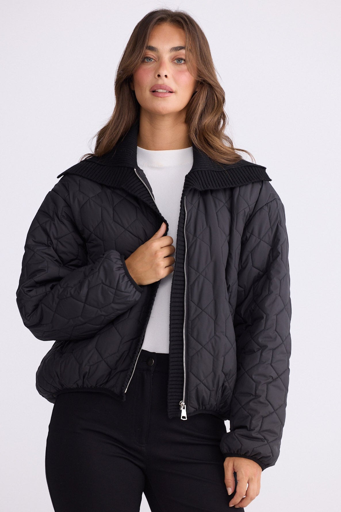 Model wearing Devin Puffer puffer jacket, alternate studio view on white background