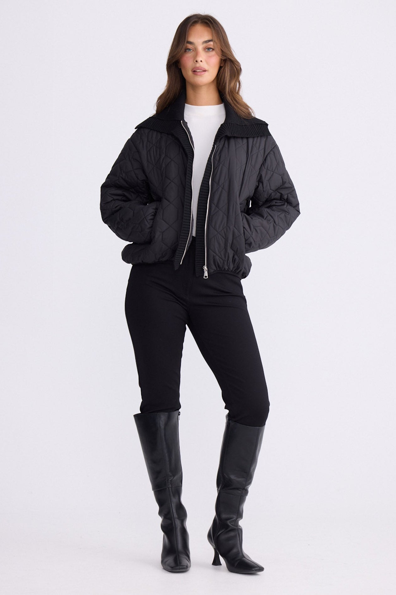 Model wearing Devin Puffer puffer jacket, alternate studio view on white background