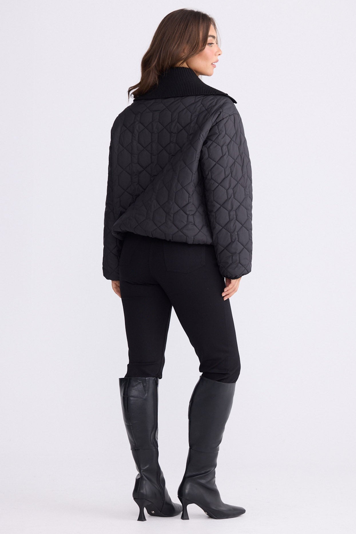 Model wearing Devin Puffer puffer jacket, alternate studio view on white background