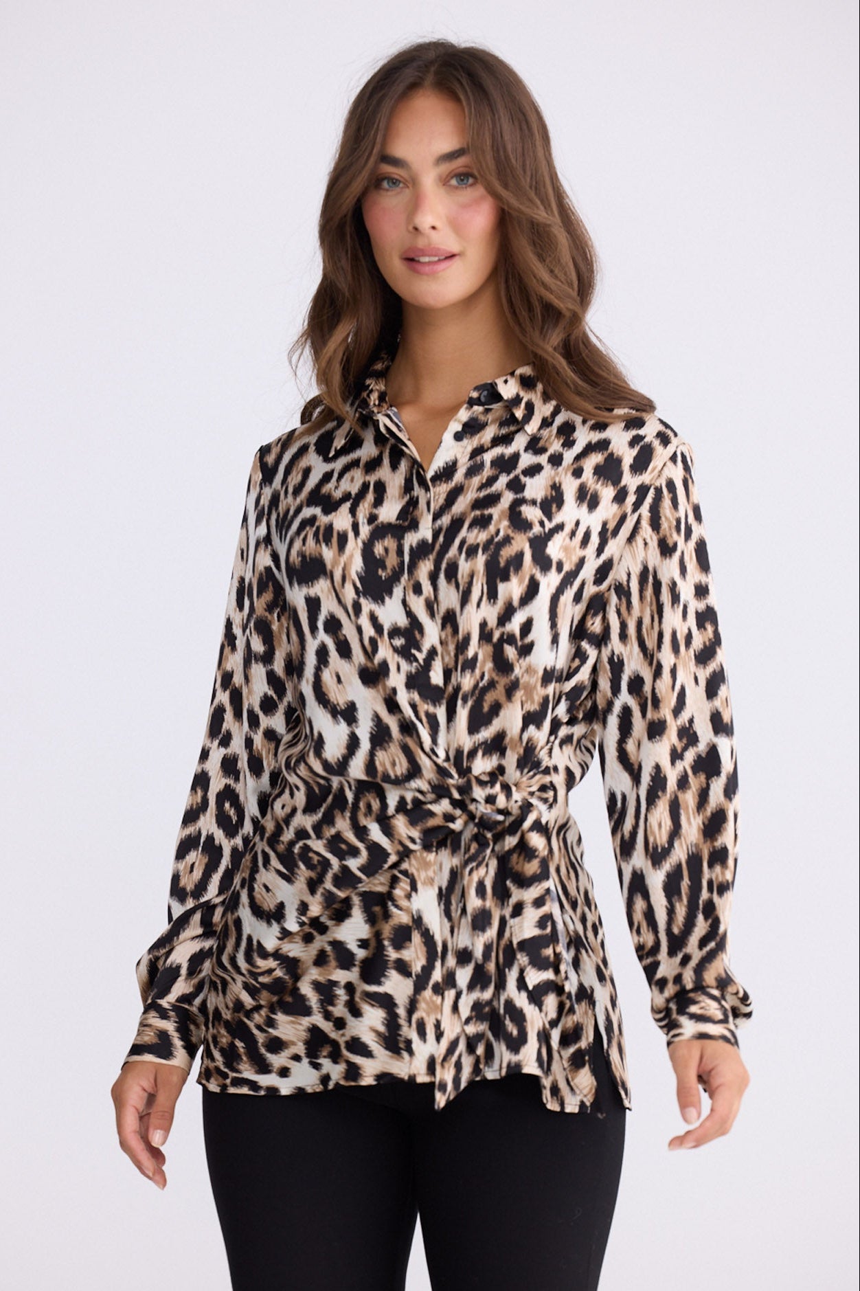 Model wearing Nova Shirt in savannah print with collar and waist tie, back view on white background