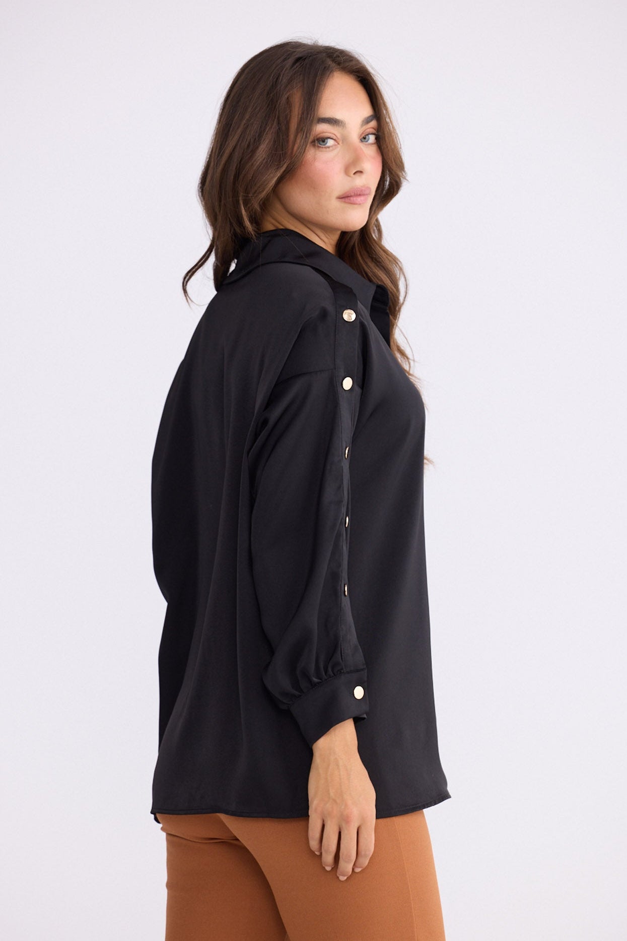 Model wearing Cassian Shirt - Black, alternate studio view on white background