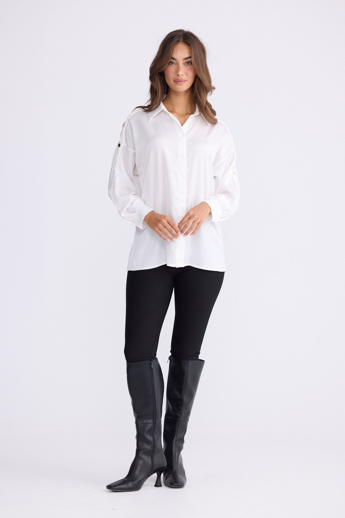 Model wearing Cassian Shirt - Ivory, studio view on white background