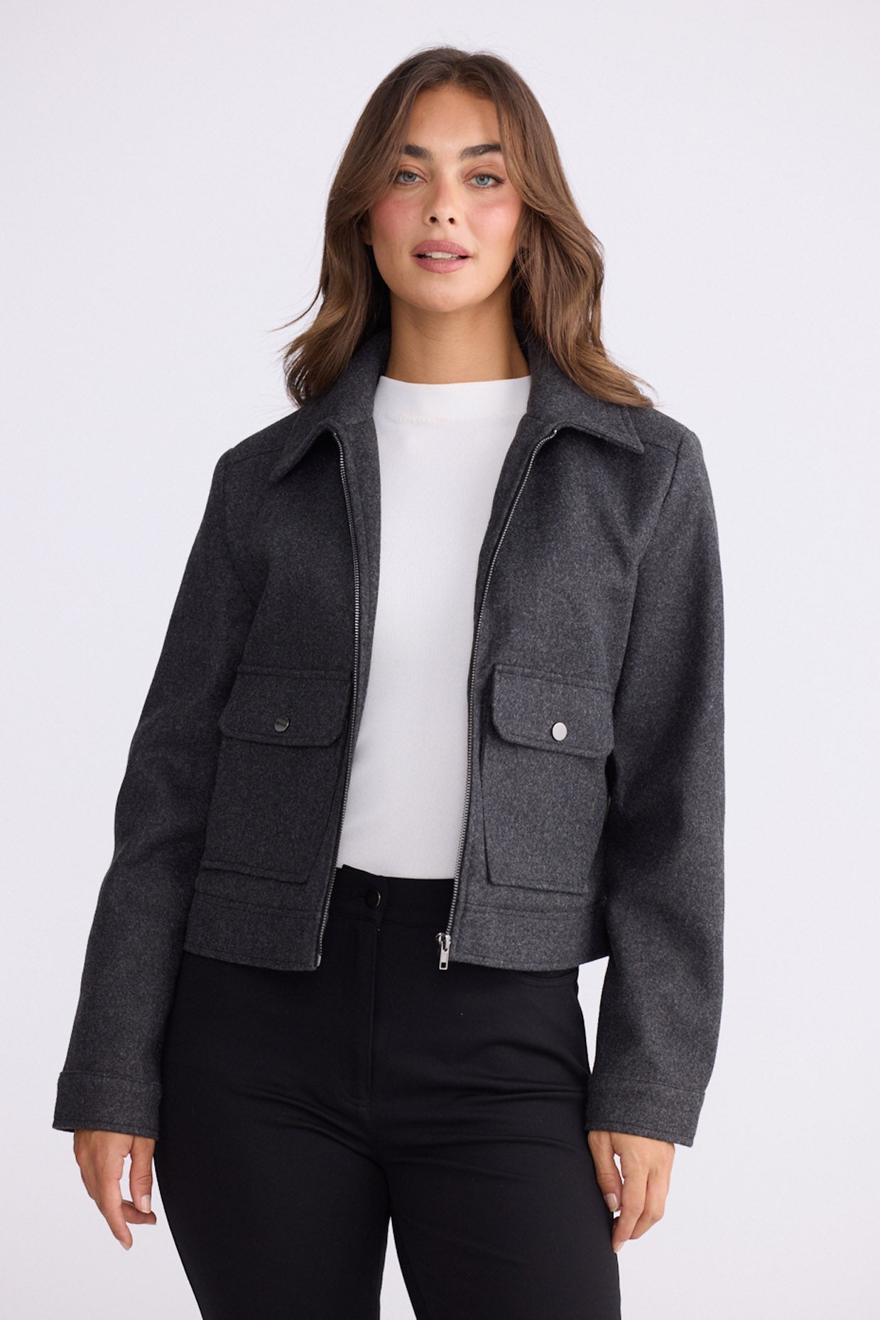 Model wearing Hollis Jacket grey jacket, front pockets with button detail, alternate studio view on white background