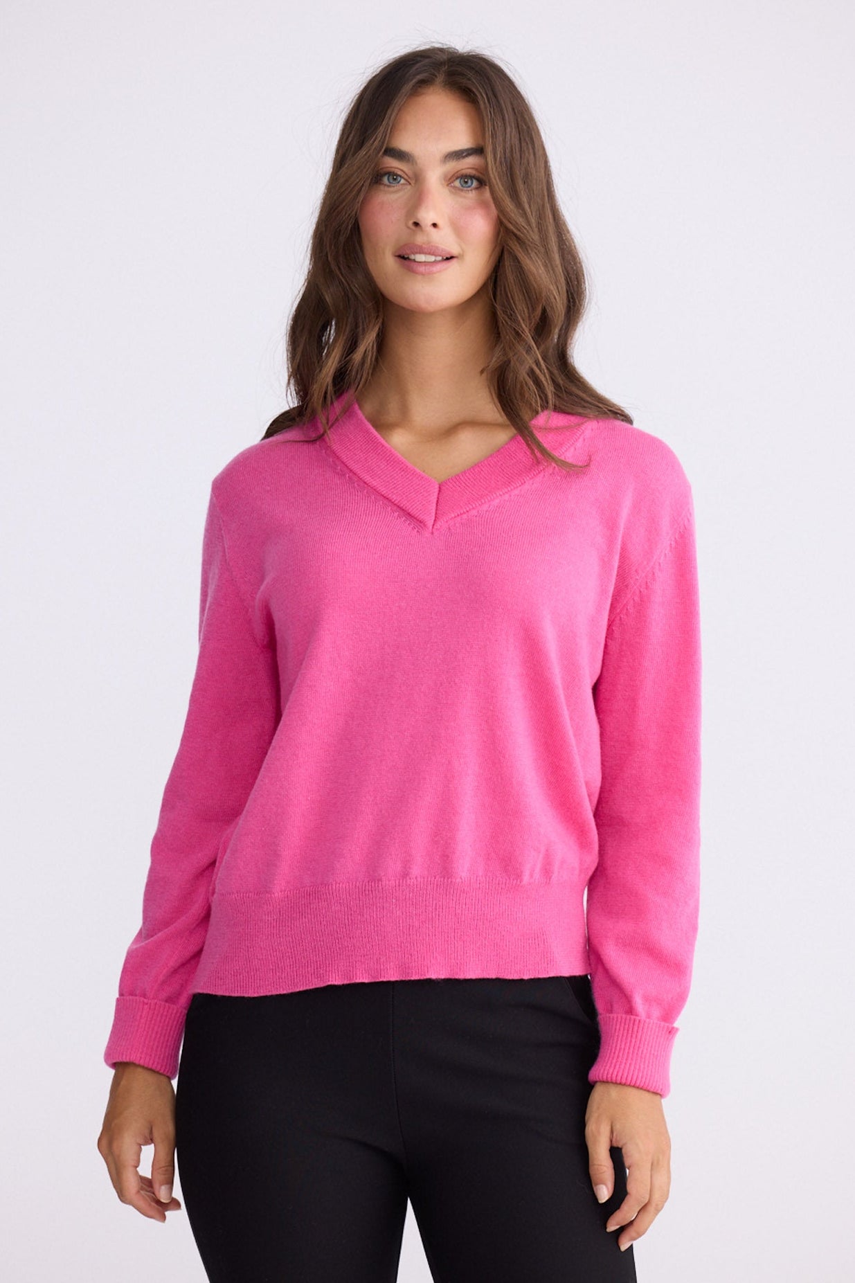 Model wearing Gwen Knit - Hot Pink, alternate studio view on white background