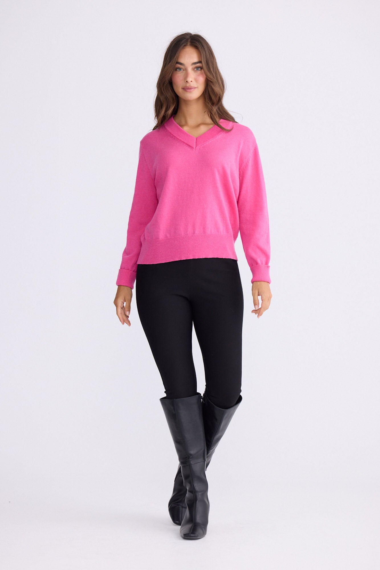 Model wearing Gwen Knit - Hot Pink, alternate studio view on white background
