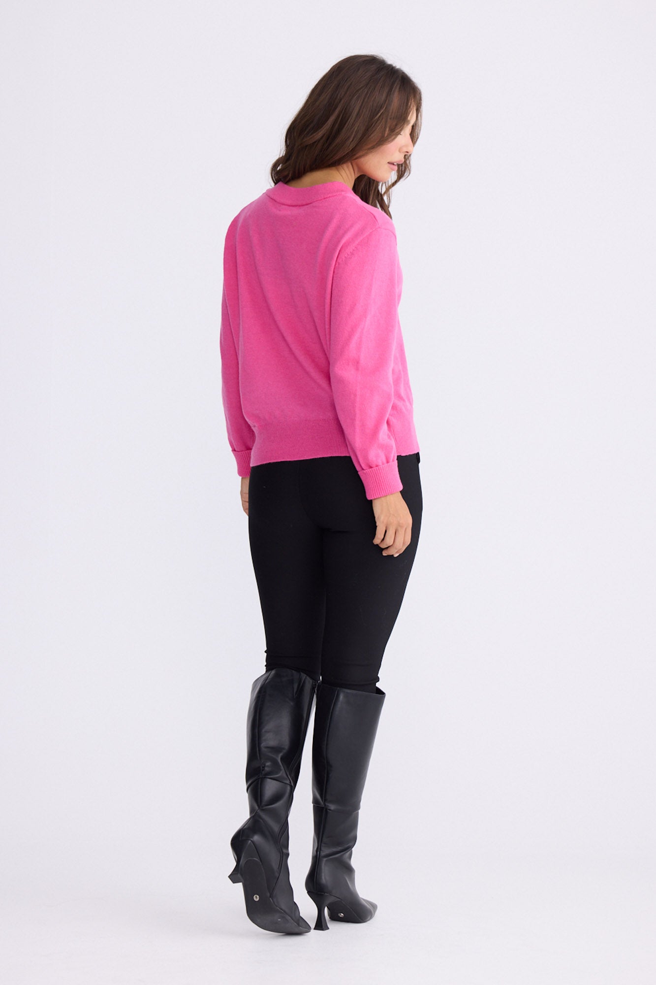 Model wearing Gwen Knit - Hot Pink, alternate studio view on white background