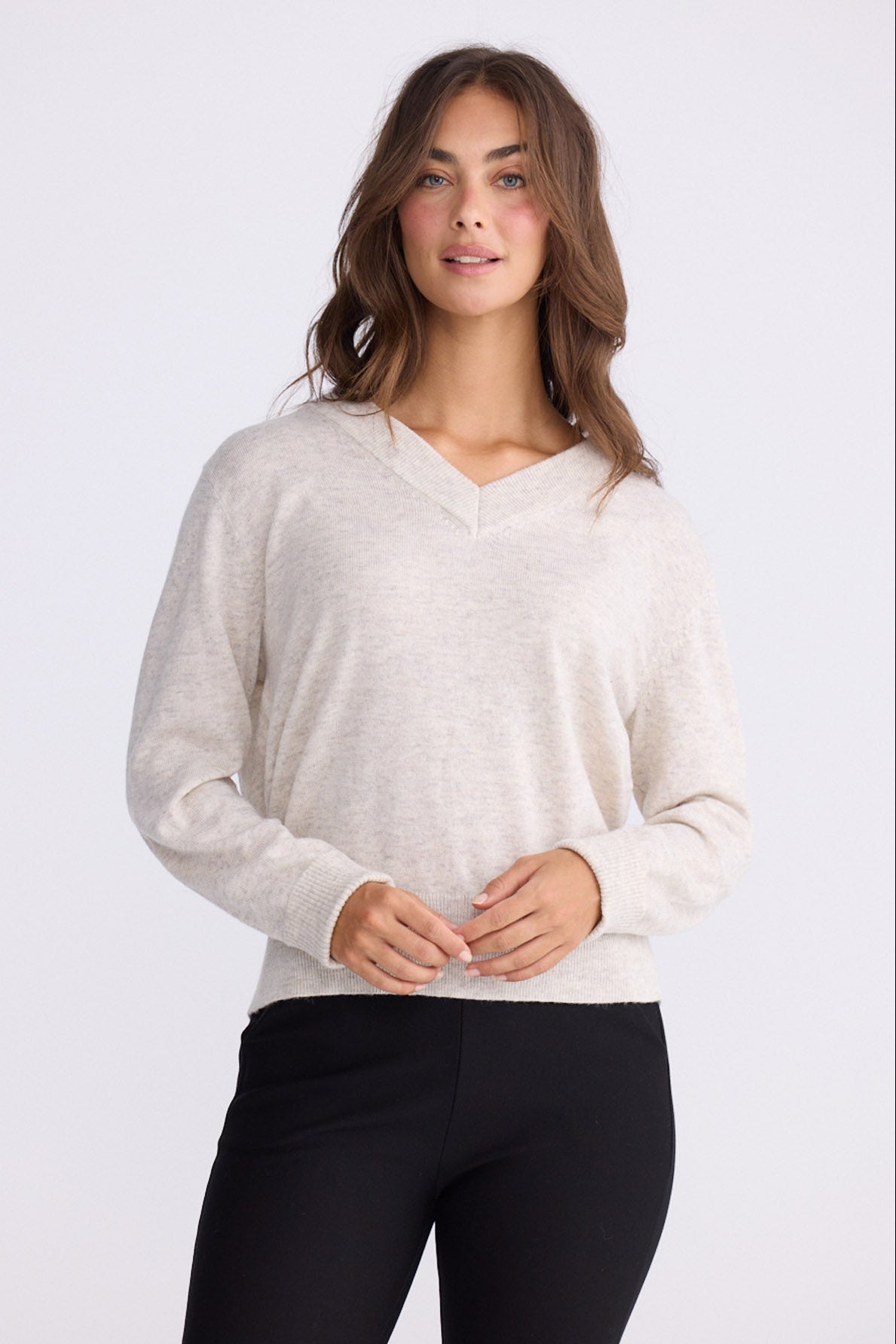 Model wearing Gwen Knit - Ivory Marle, studio view on white background