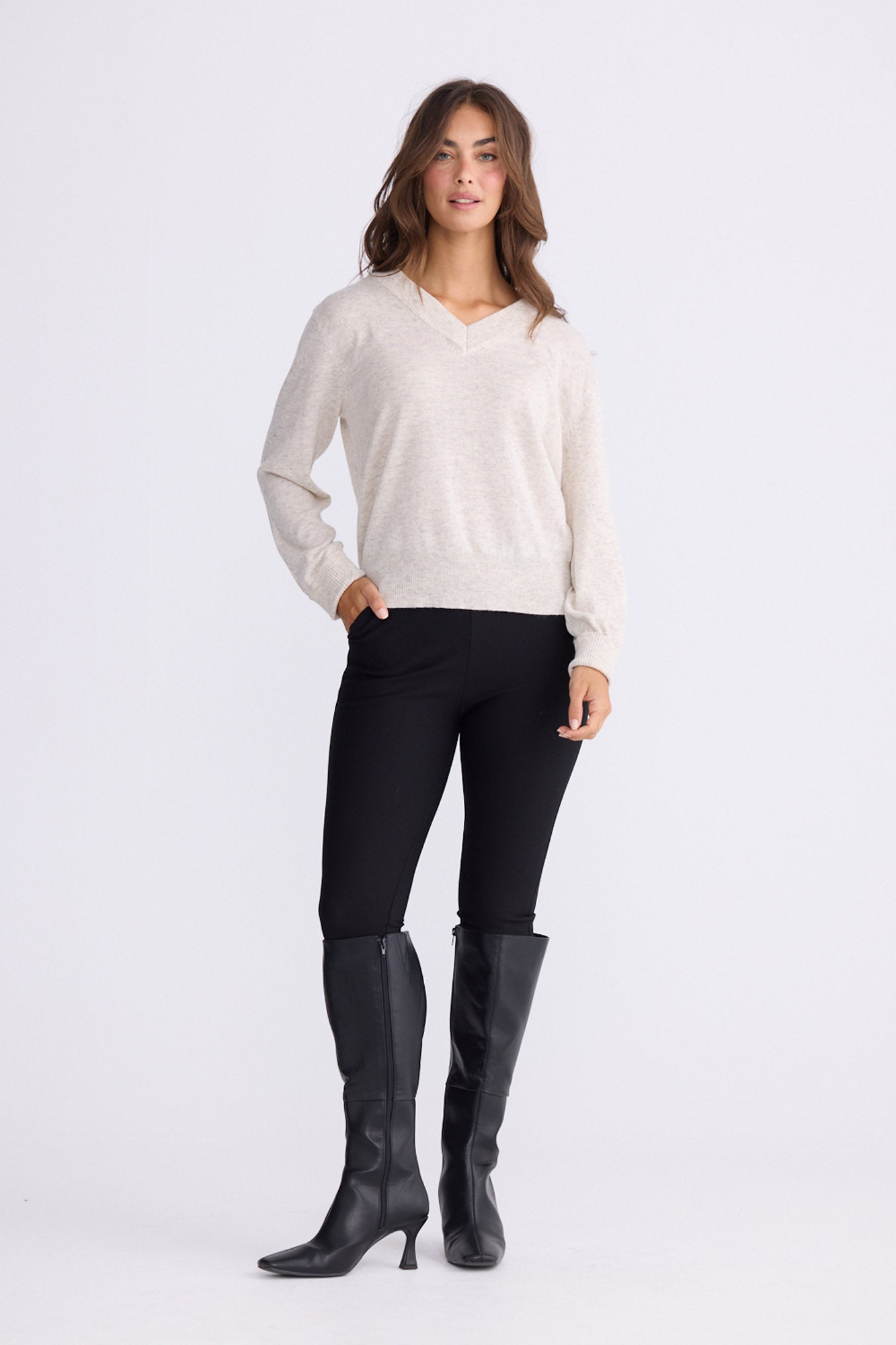 Model wearing Gwen Knit - Ivory Marle, alternate studio view on white background