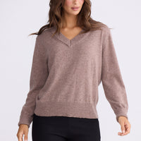 Model wearing Gwen Knit - Oat Marle, studio view on white background