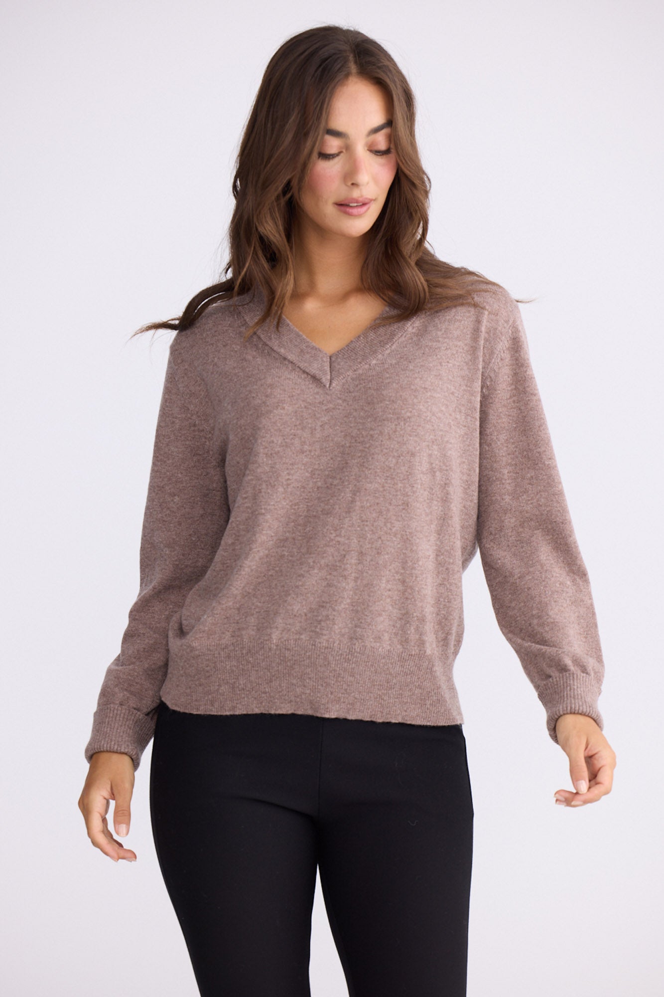Model wearing Gwen Knit - Oat Marle, studio view on white background