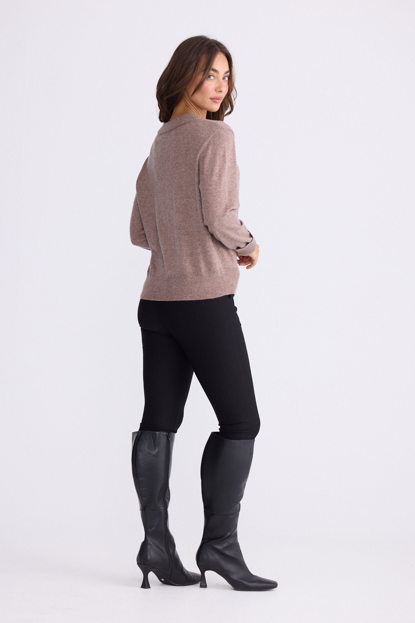 Model wearing Gwen Knit - Oat Marle, alternate studio view on white background