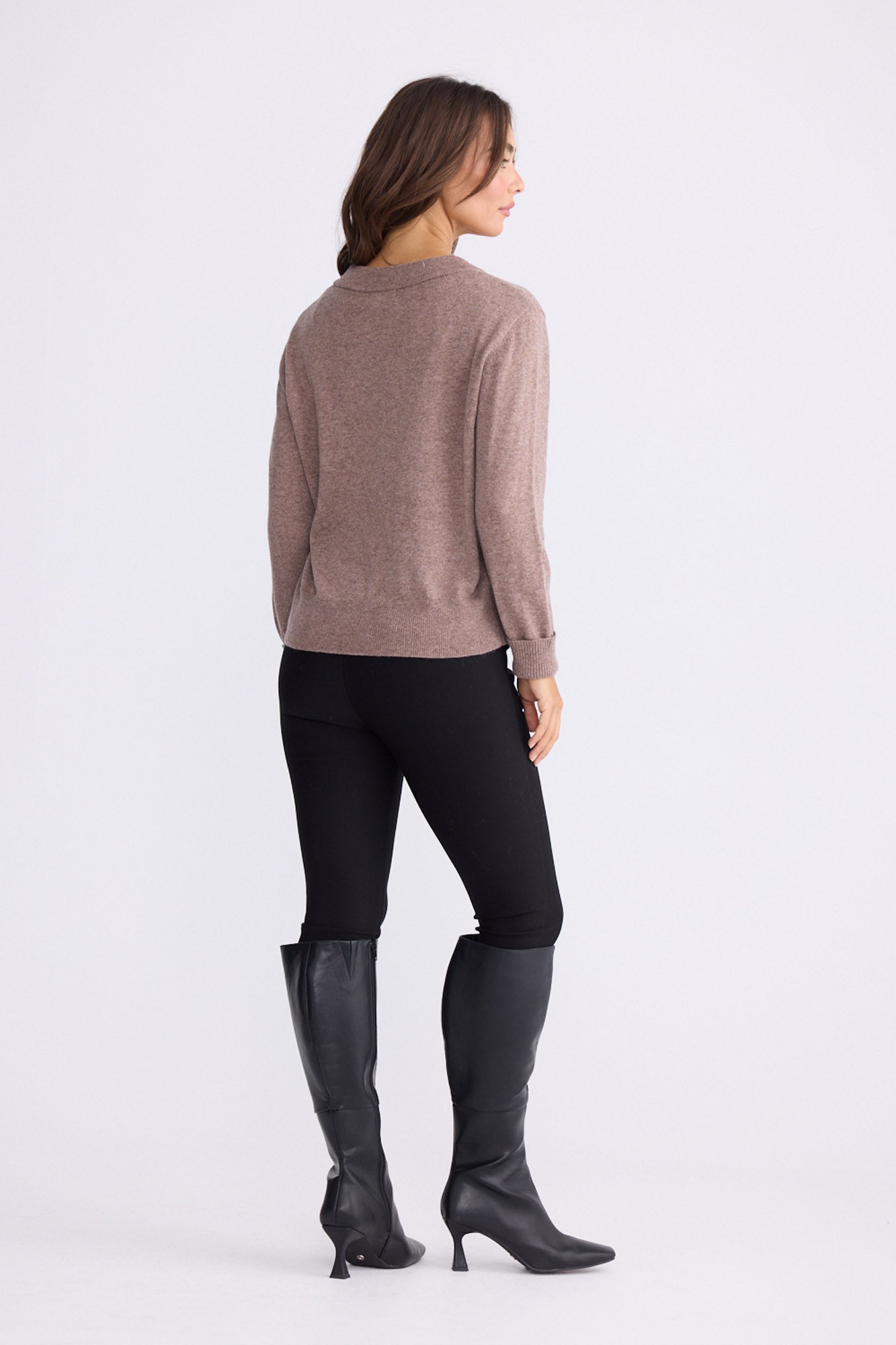 Model wearing Gwen Knit - Oat Marle, alternate studio view on white background