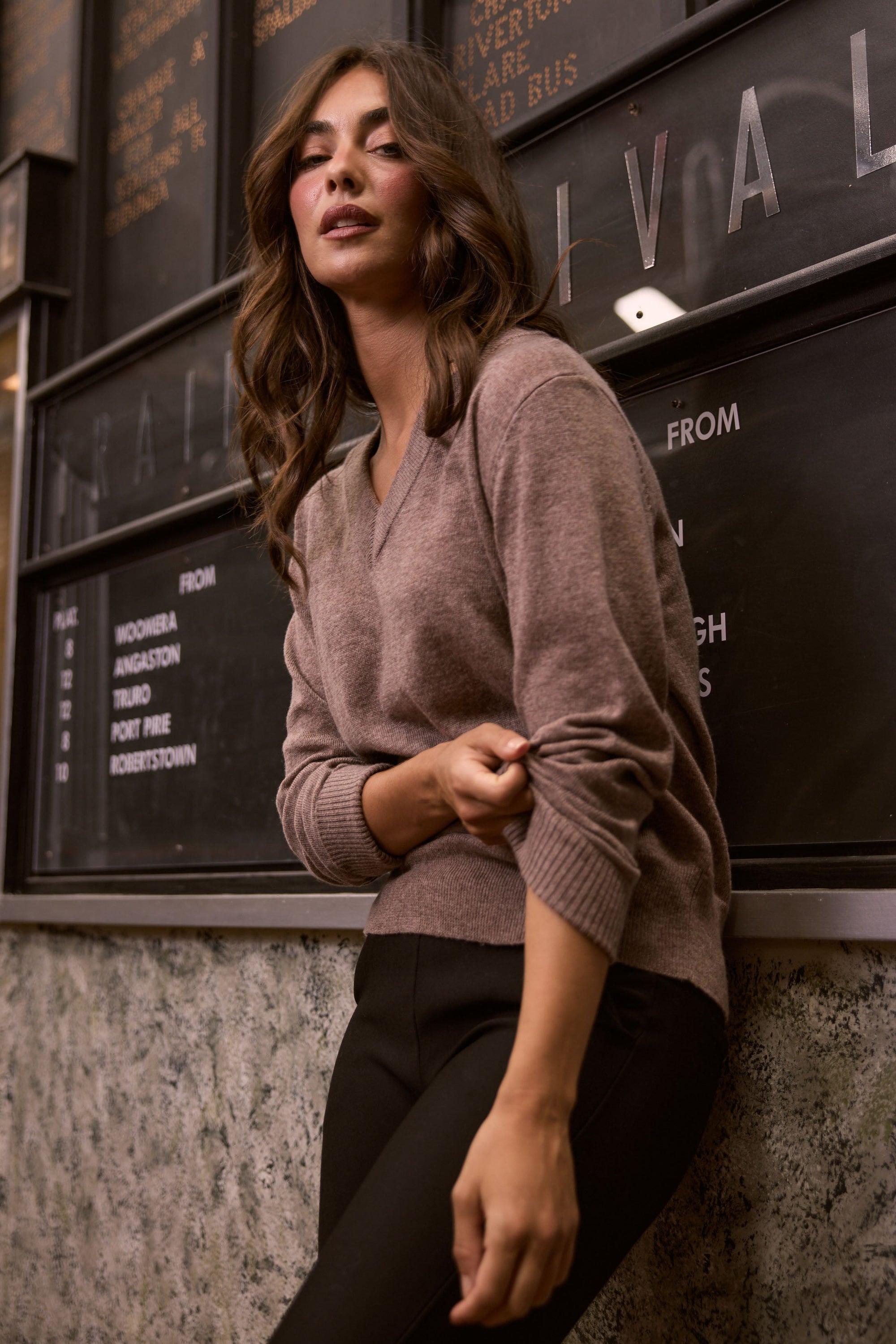 Model wearing Gwen Knit - Oat Marle, campaign view on white background