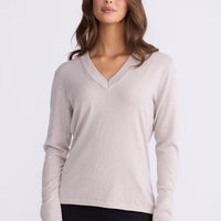 Model wearing Cassian LS Knit Top - Dove, alternate studio view on white background