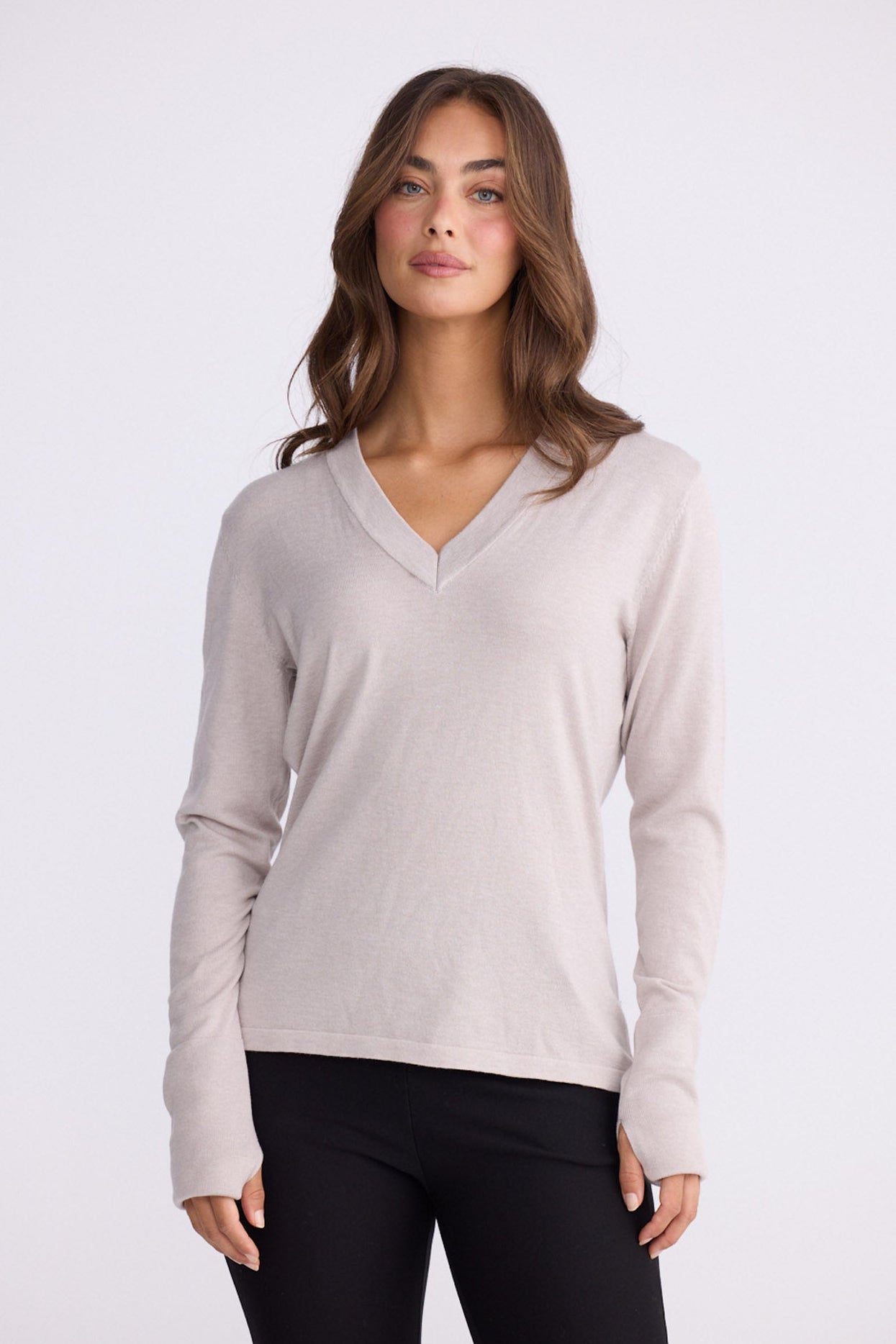 Model wearing Cassian LS Knit Top - Dove, alternate studio view on white background