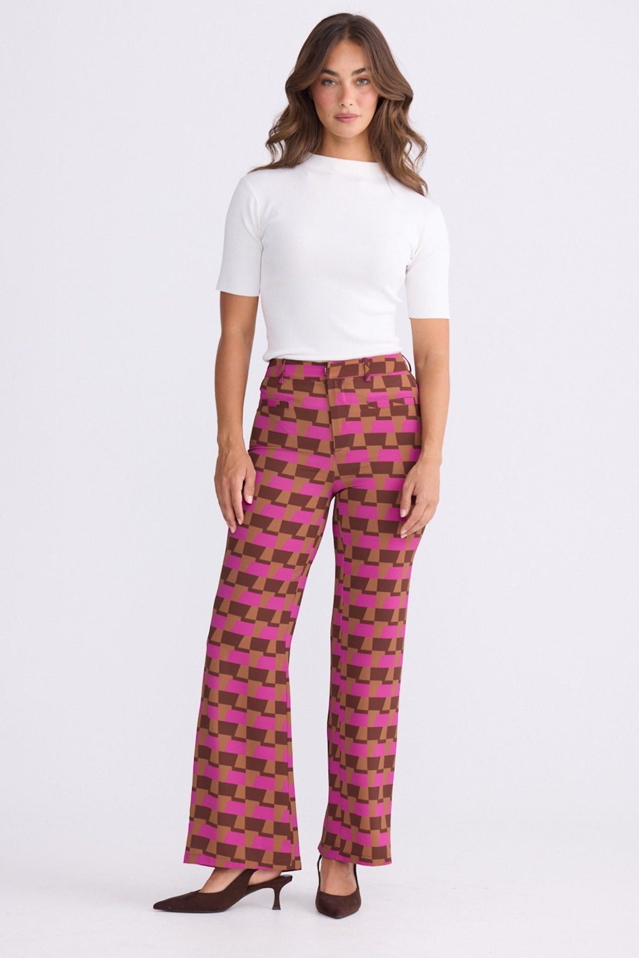 Model wearing Tressa Geo Prism geometric flared pants with high-rise waist, alternate view on white background