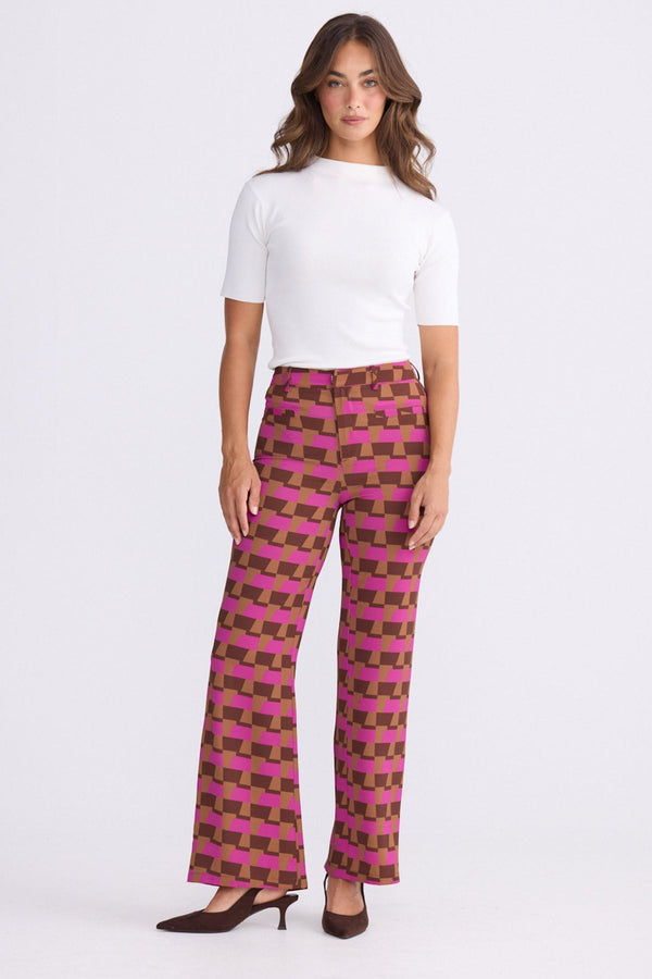 Model wearing Tressa Geo Prism geometric flared pants with high-rise waist, alternate view on white background