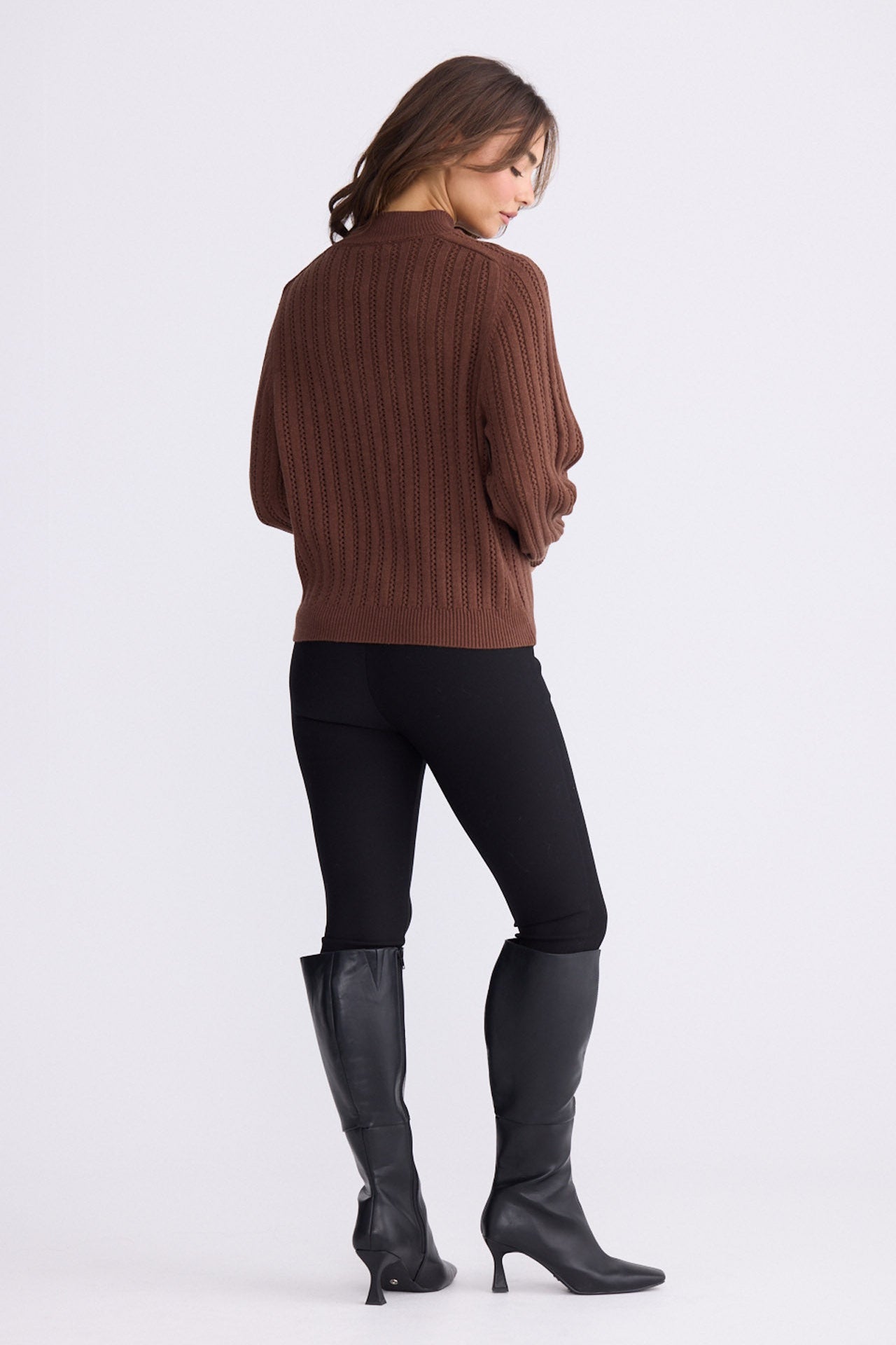 Model wearing Shea Knit in brown with crew neckline and long sleeves, front view on white background