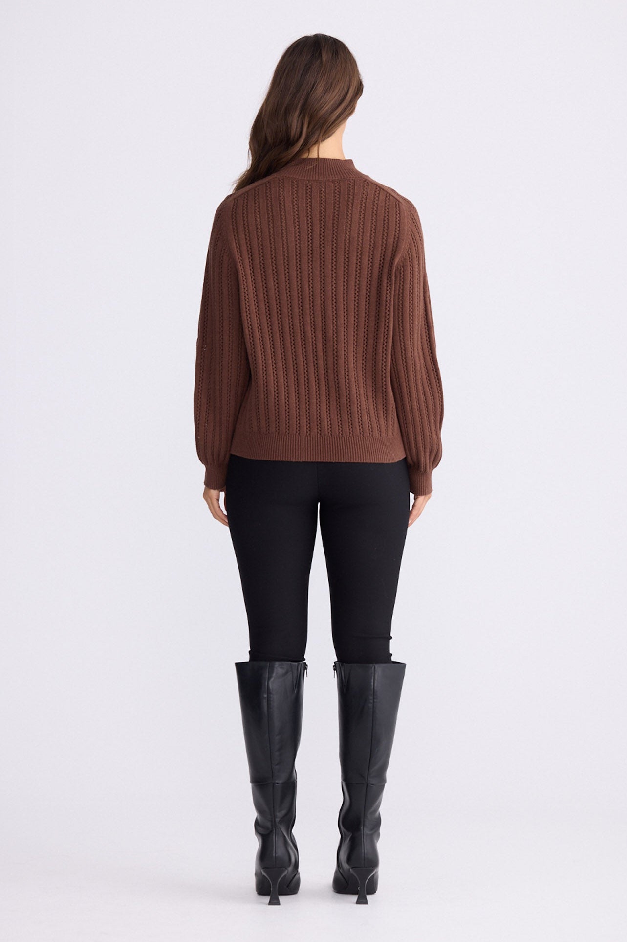 Model wearing Shea Knit in brown with crew neckline and long sleeves, back view on white background