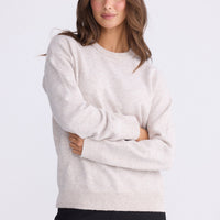 Model wearing Casey Knit - Oat, alternate studio view on white background